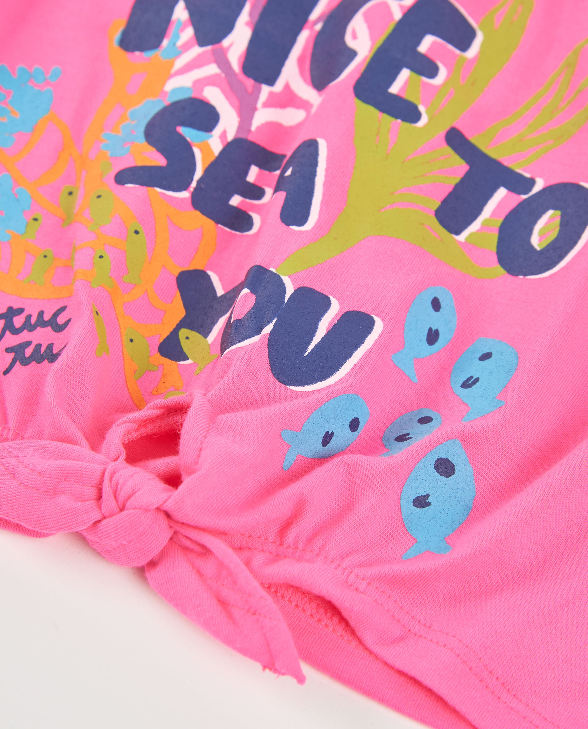 Camiseta de niña de punto con nudo en el bajo