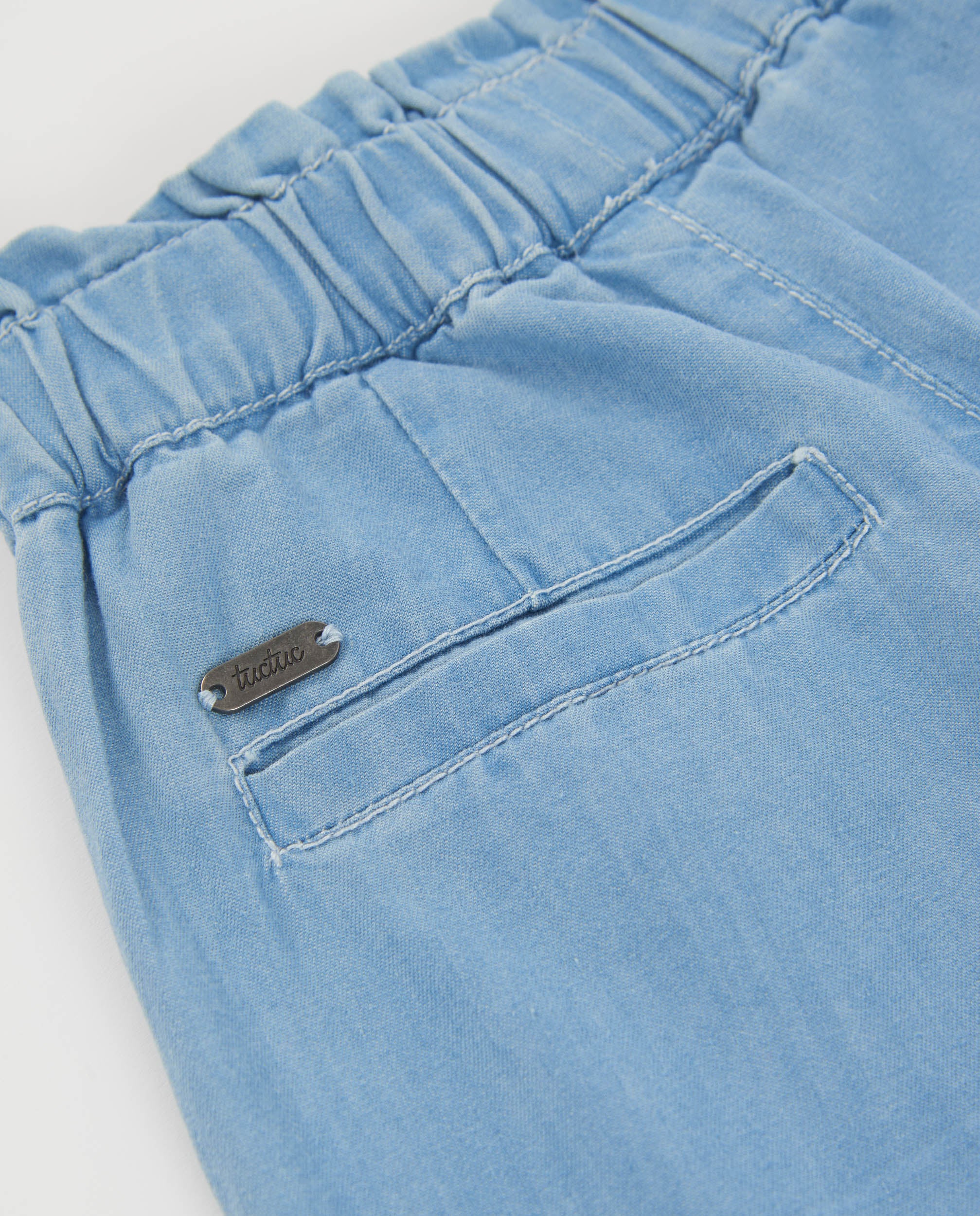 Pantalones de niña de plana y denim claro