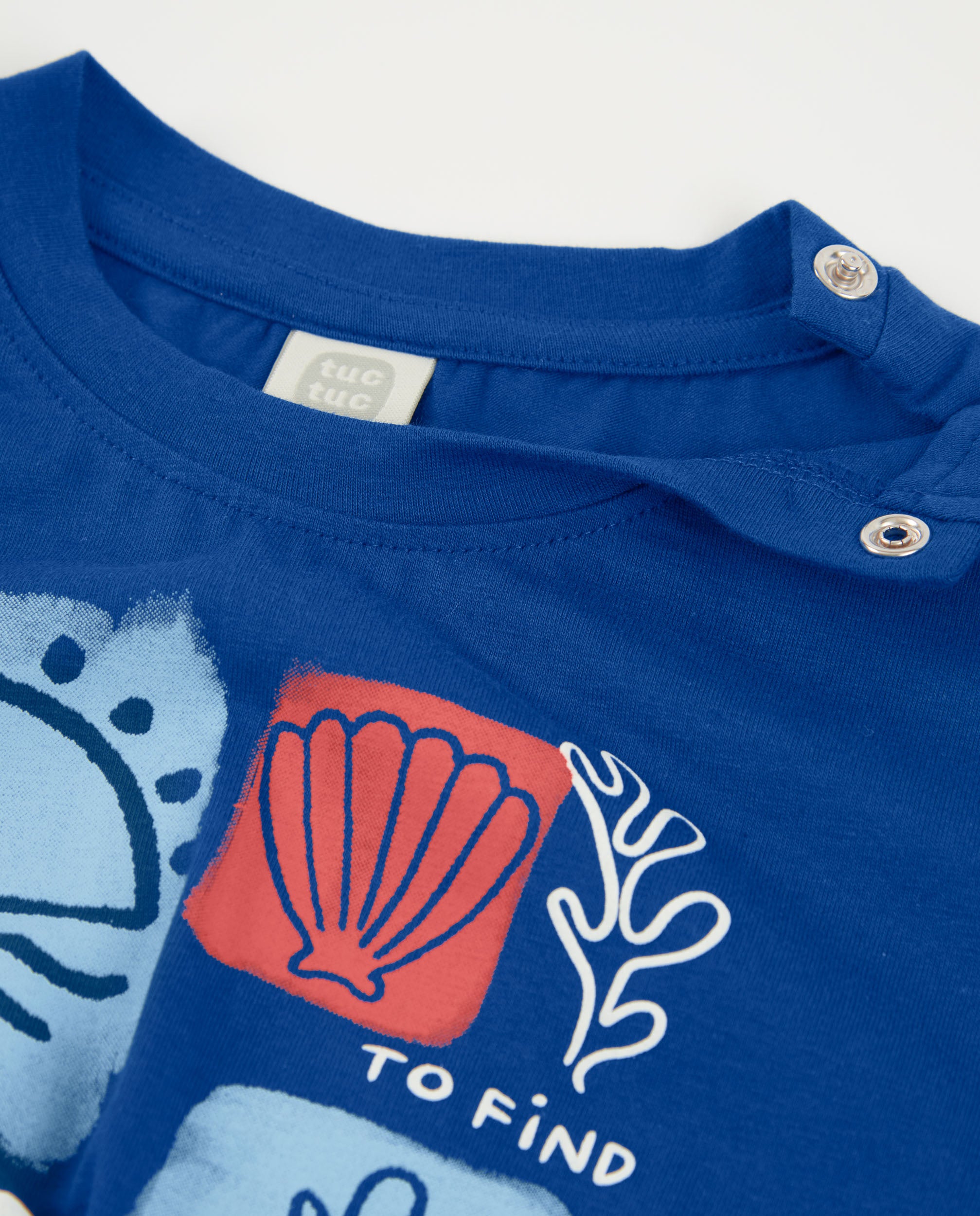 Camiseta de niña de punto y nudo decorativo en el bajo