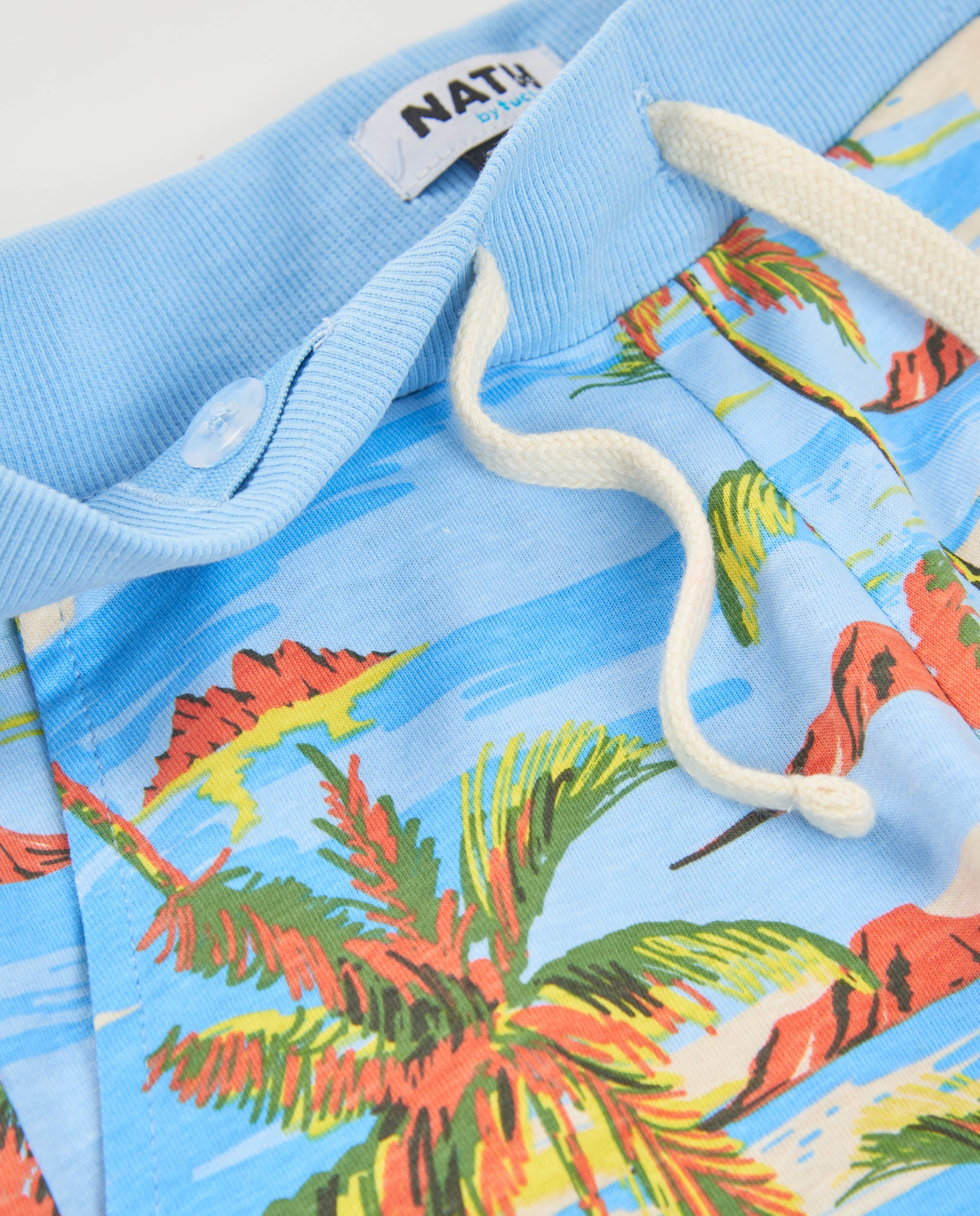 Bermuda de niño de punto con estampado de palmeras