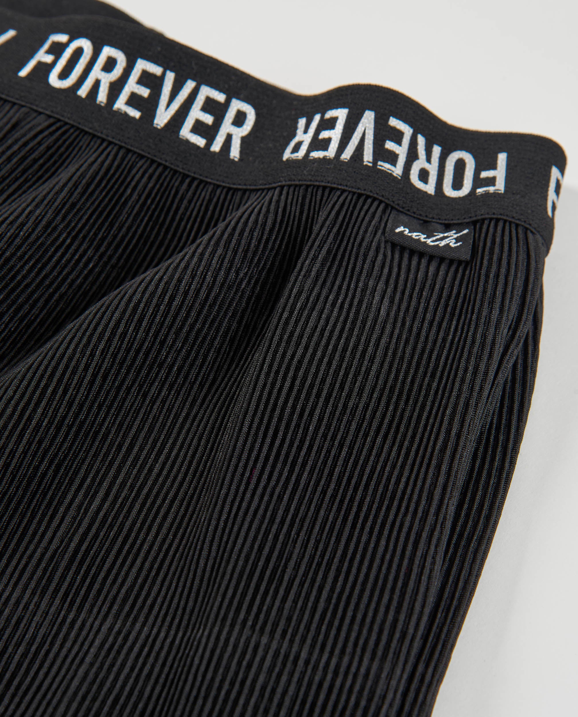 Pantalones de niña de punto con tejido canalé