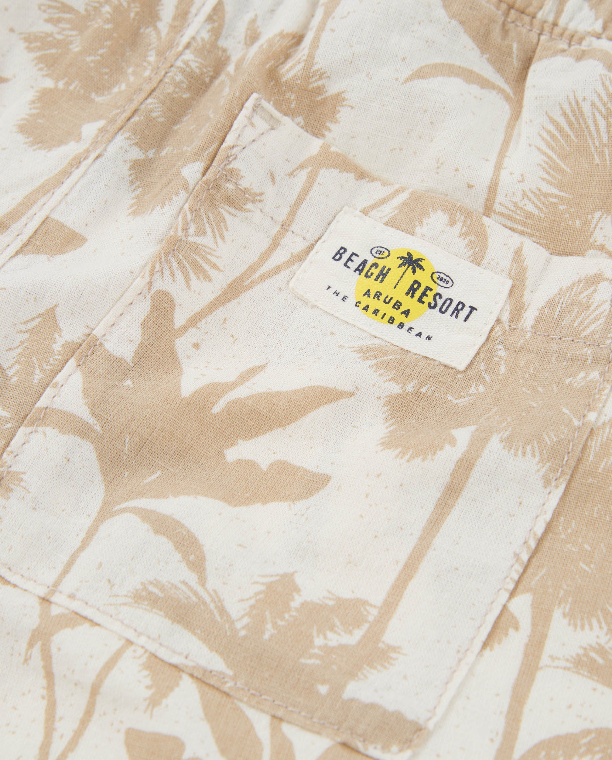 Bermuda de niño de plana con estampado de palmeras