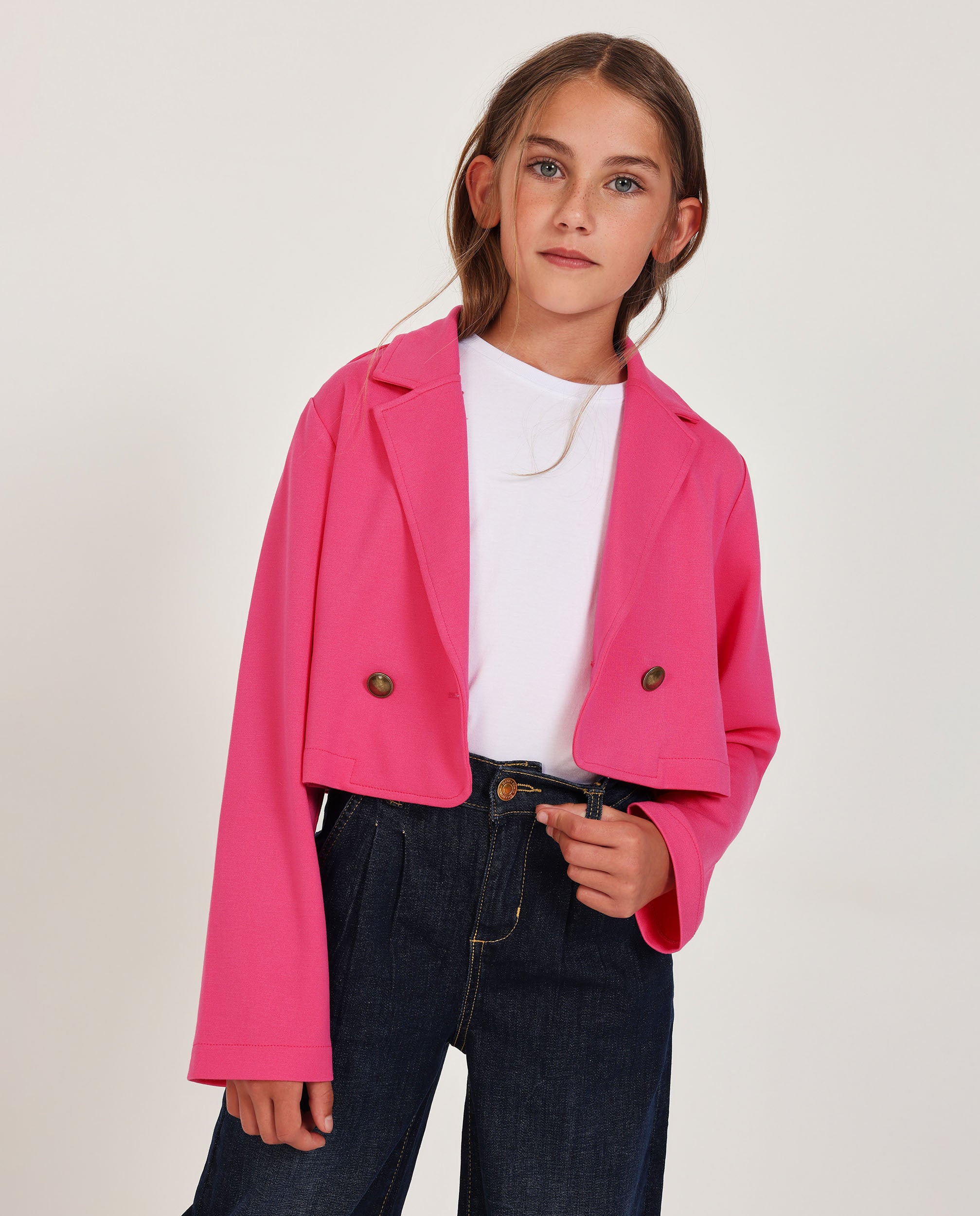 Americana de niña de punto con diseño cruzado