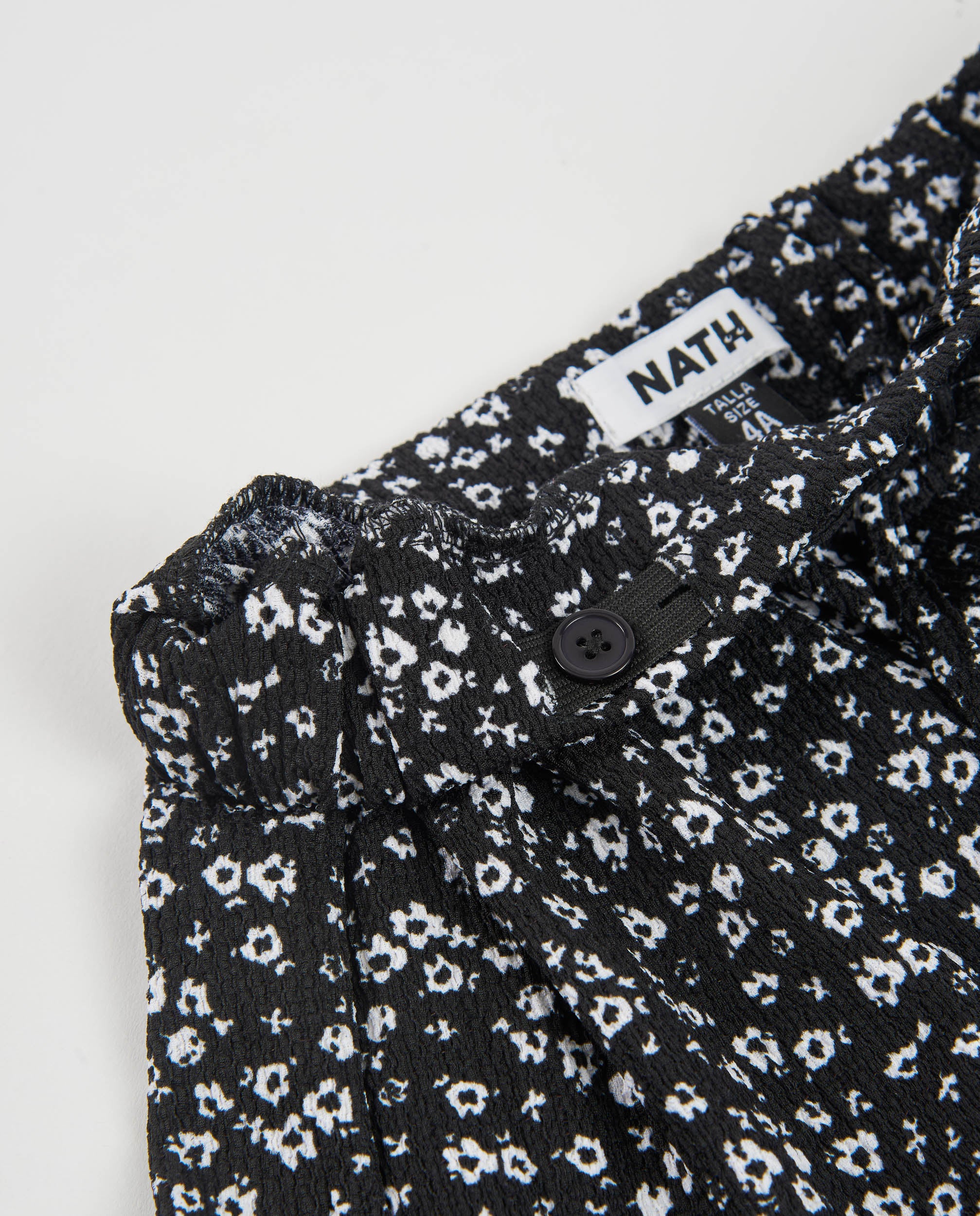 Falda de niña de tela plana con diseño floral y volantes