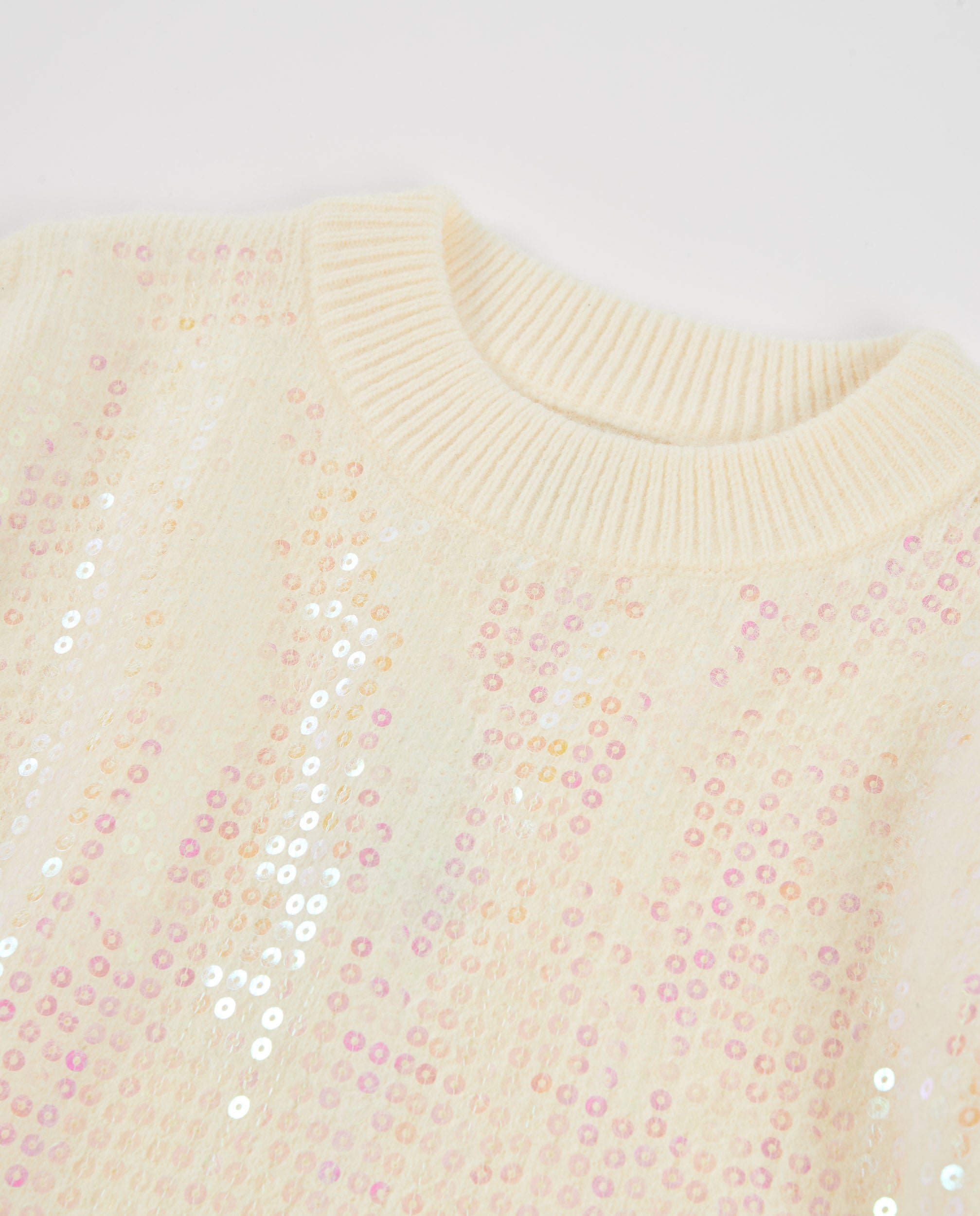 Jersey de niña de tricot con lentejuelas y cuello redondo