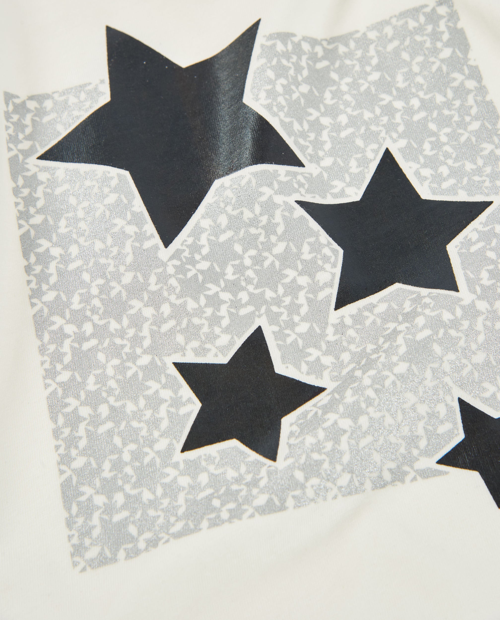 Camiseta de niña de punto con manga larga y detalle de estrellas
