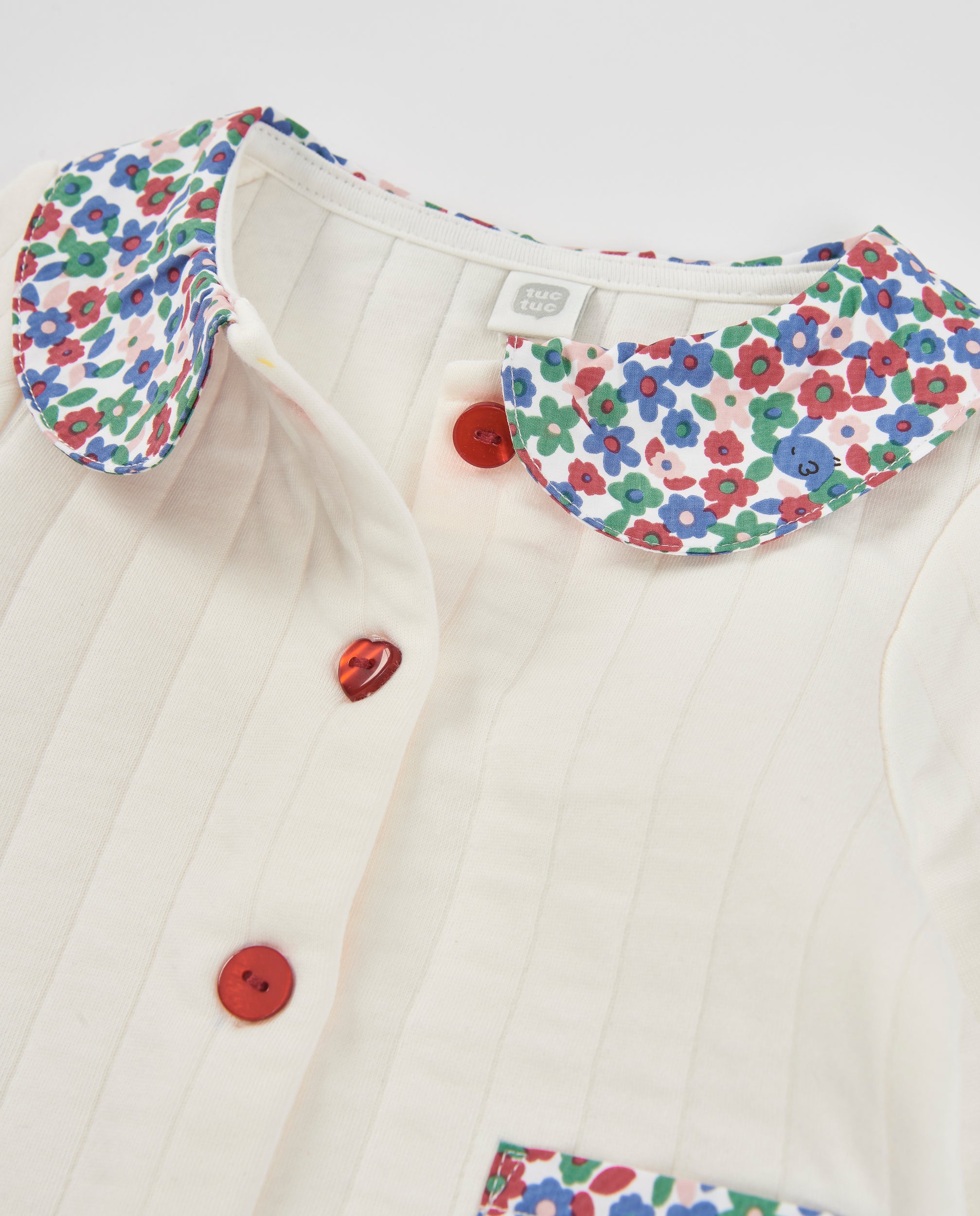 Chaqueta de punto de bebé con cuello floral
