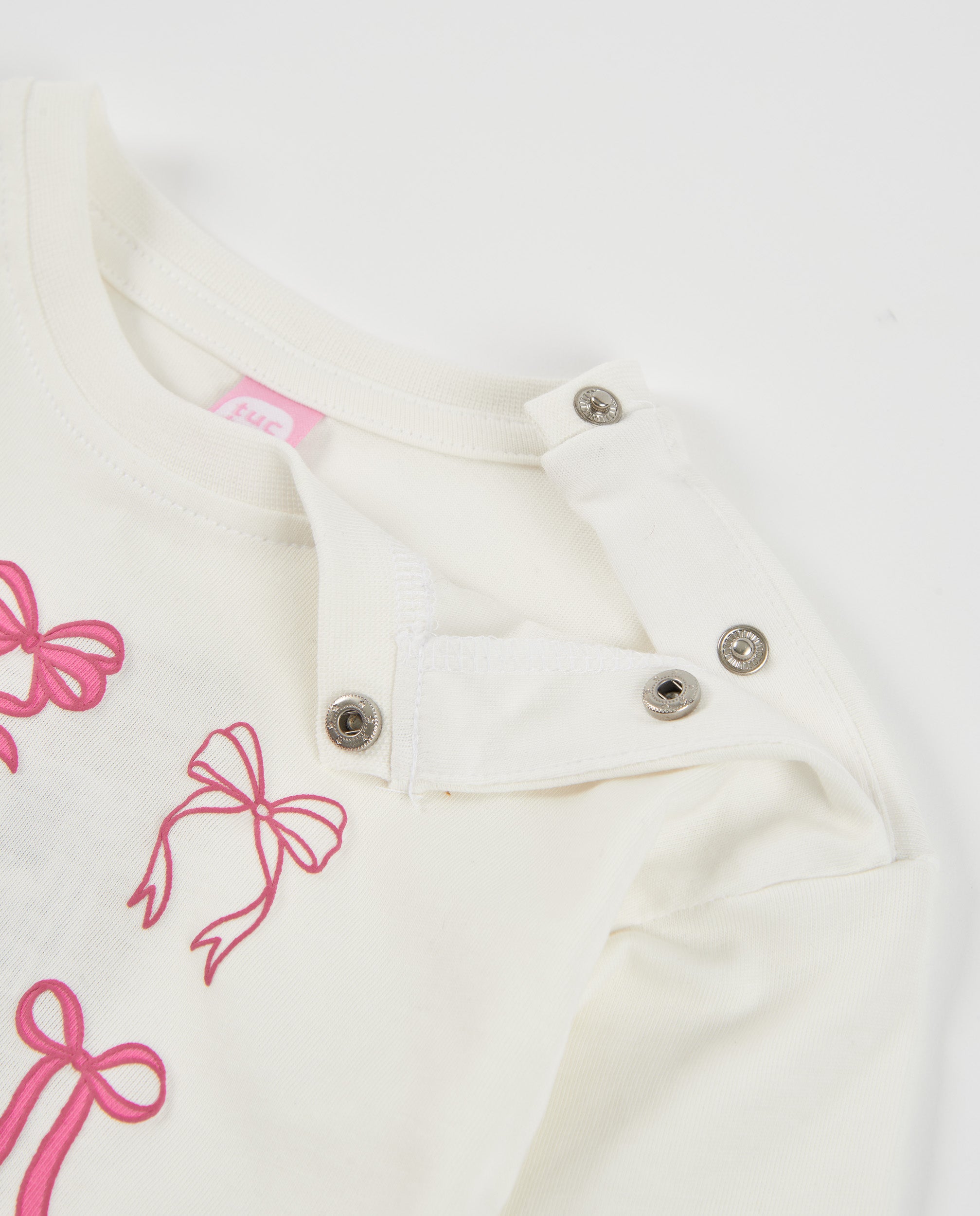 Camiseta de niña de punto con manga larga y diseño de lazos
