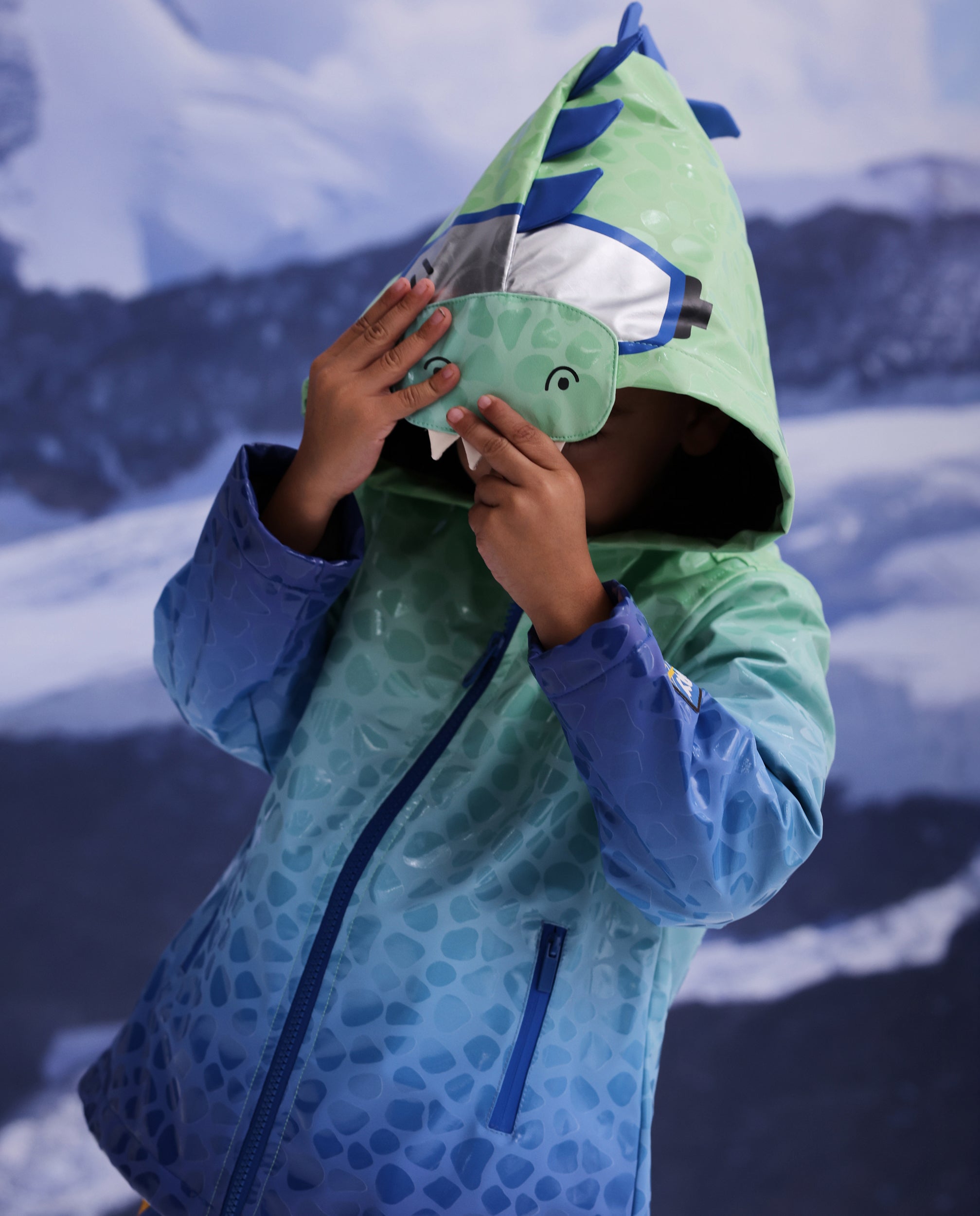 Chubasquero de niño con capucha y diseño de cocodrilo