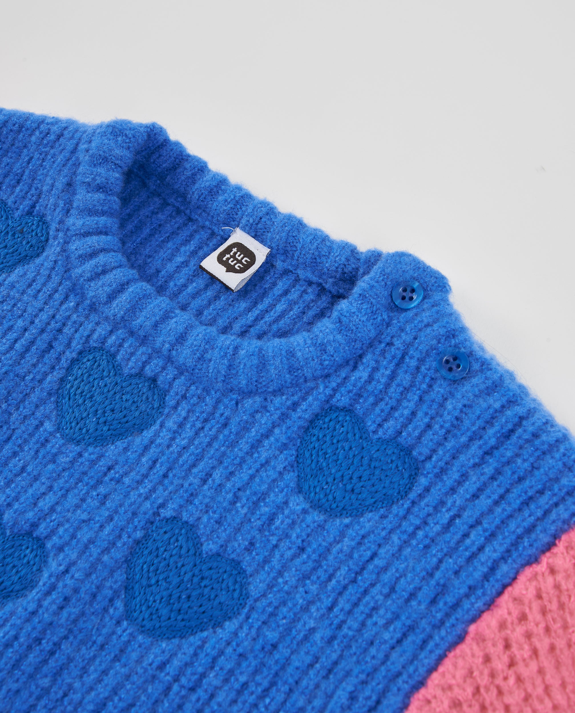 Jersey de niña de tricot con corazones y mangas bicolor