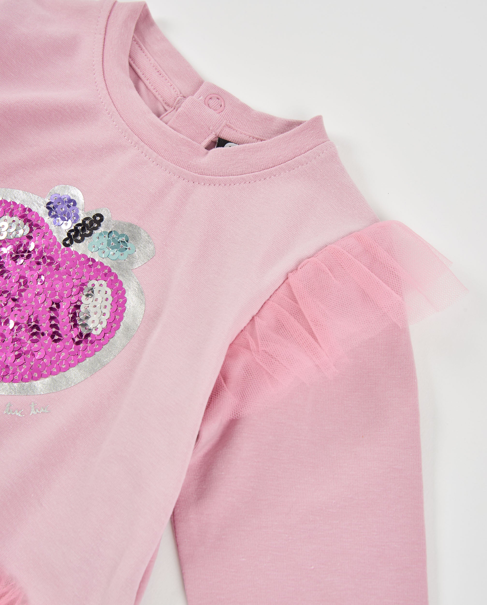 Camiseta de niña de punto con volantes y detalle de lentejuelas