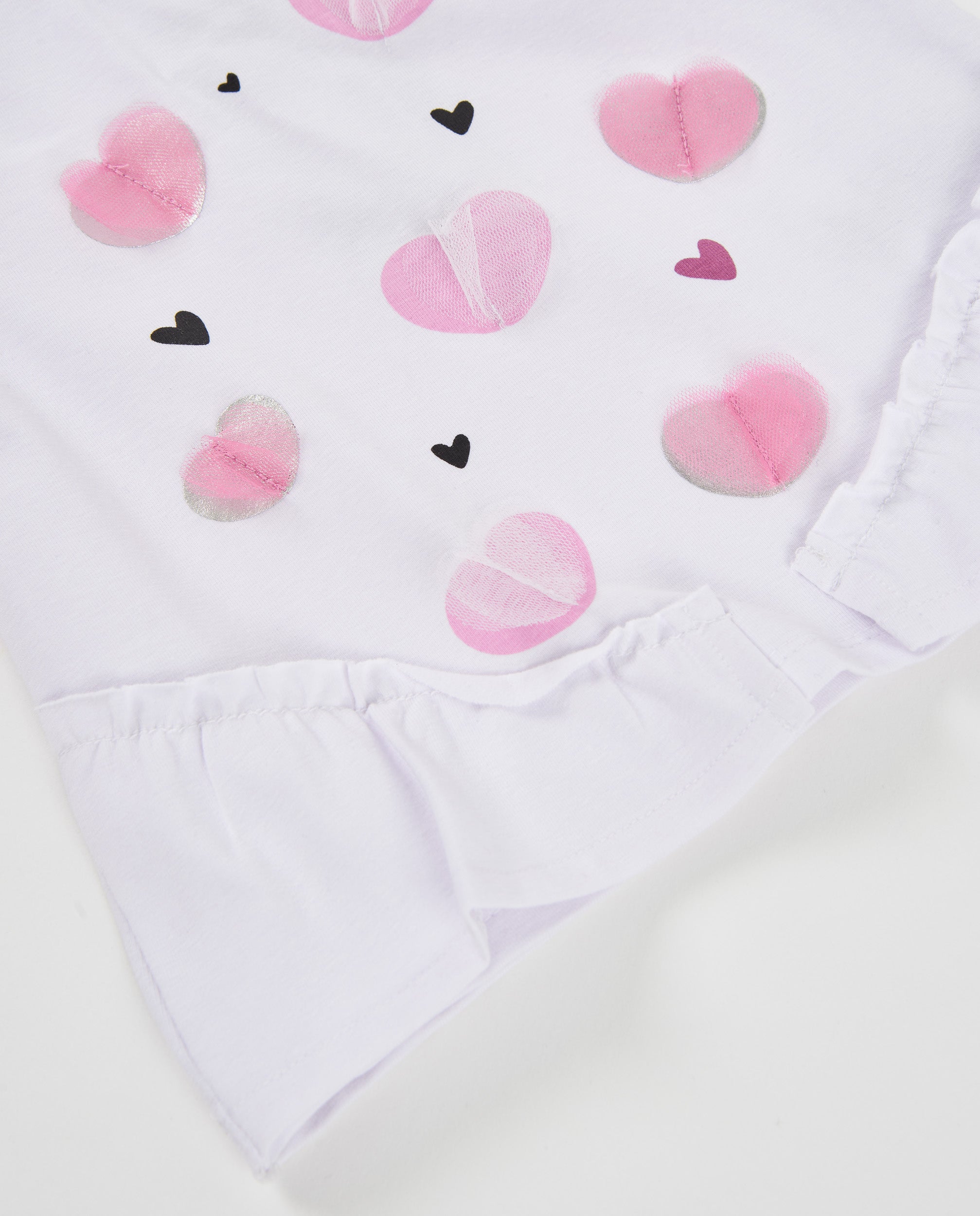 Camiseta de niña de punto con volante y estampado de corazones