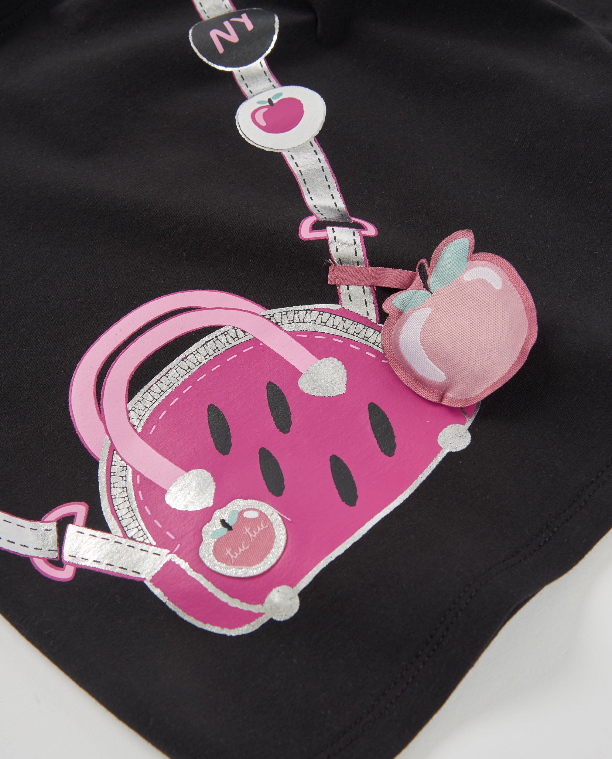 Camiseta de niña de punto con diseño de bandolera y manga larga