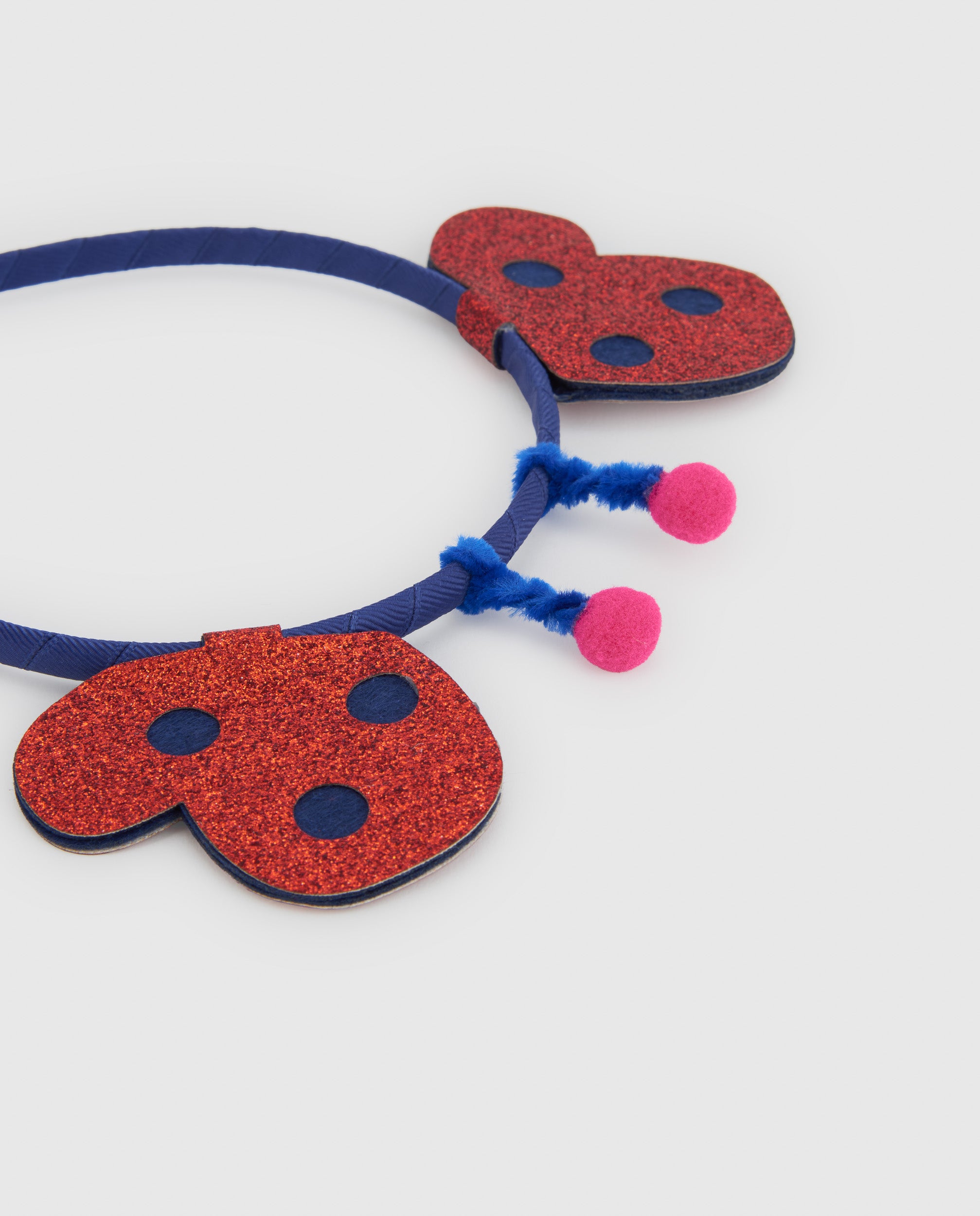 Diadema de niña con antenas y diseño de mariquita