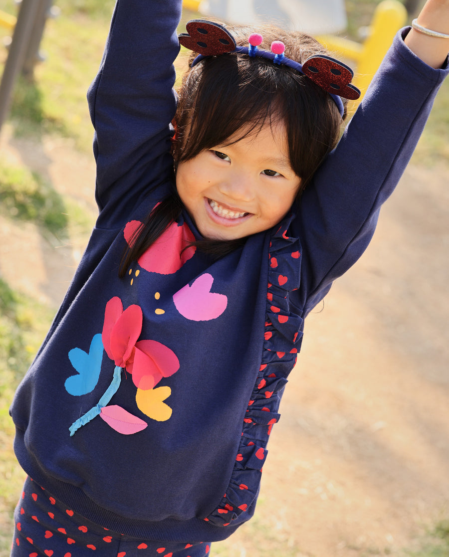 Girl's fleece sweatshirt with floral print and ruffles