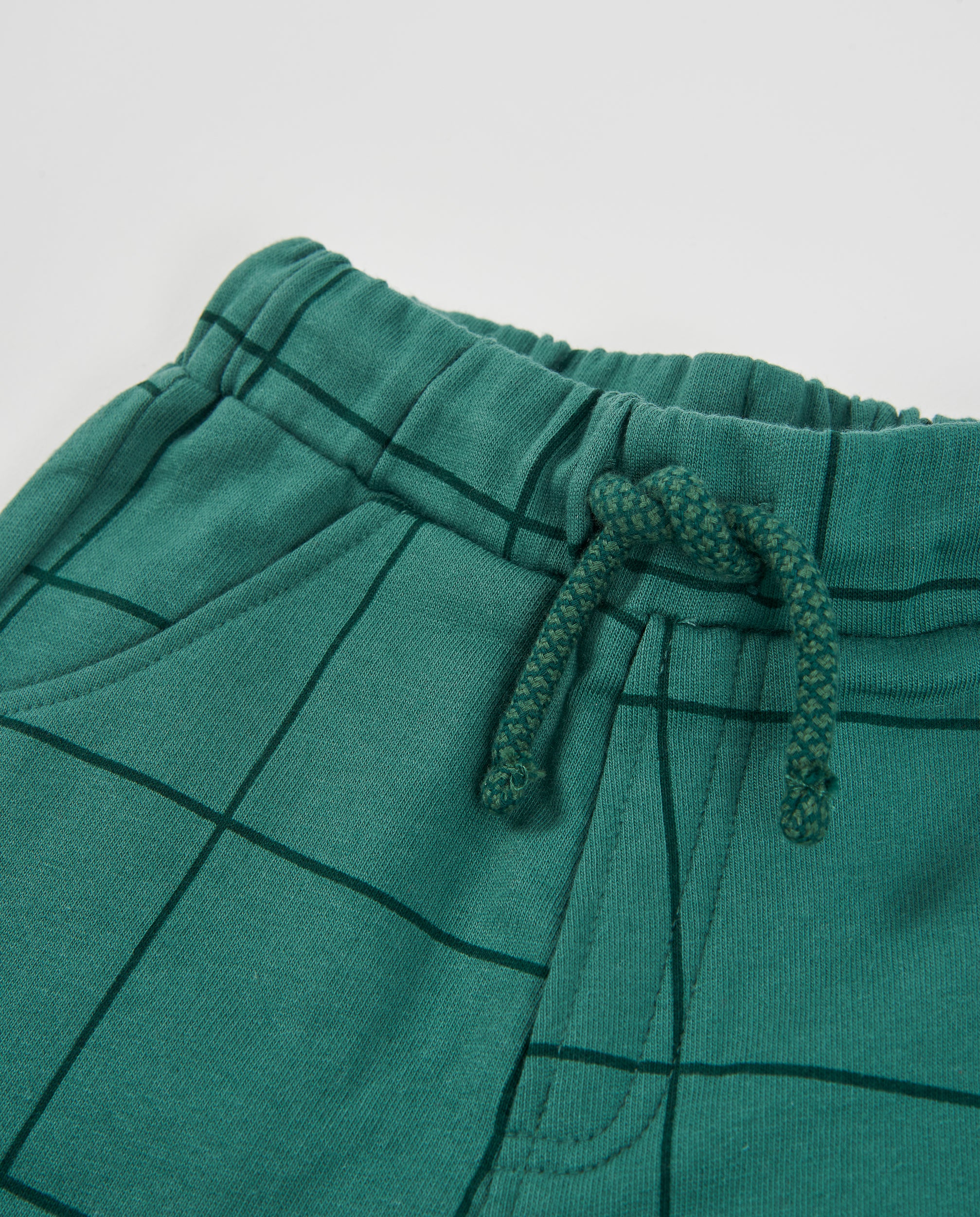 Pantalón de niño de felpa con diseño de cuadros y cordón