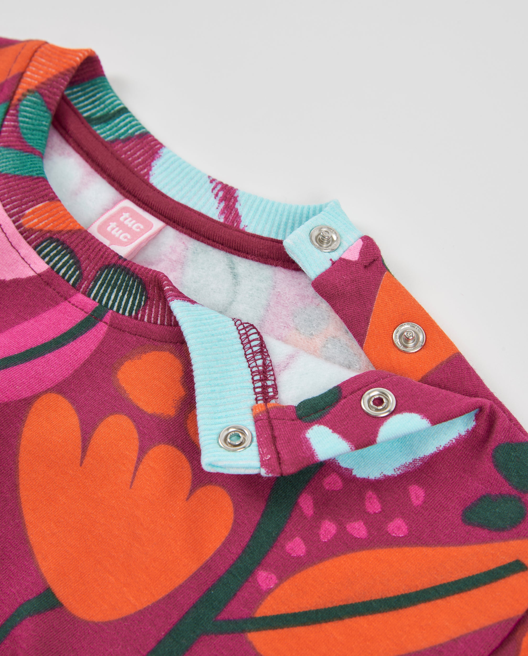 Sudadera de niña de felpa con estampado floral y colores vivos
