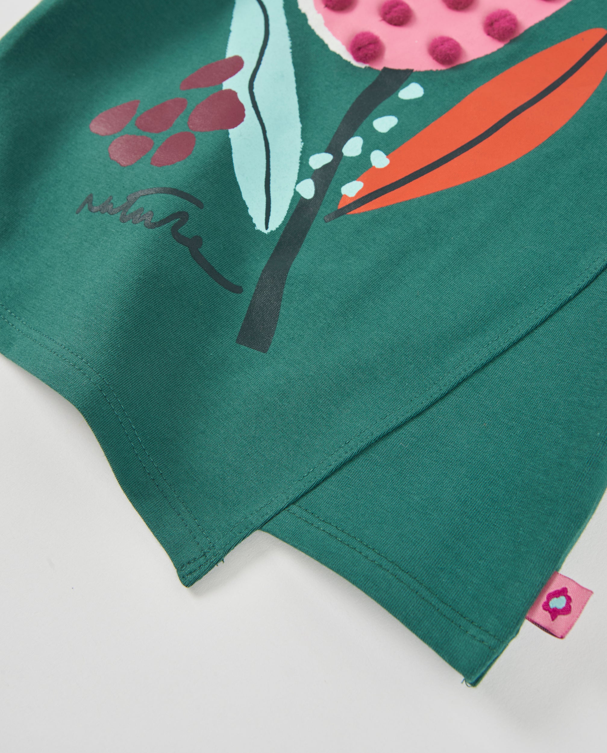 Camiseta de niña de punto con pompones en relieve y estampado floral