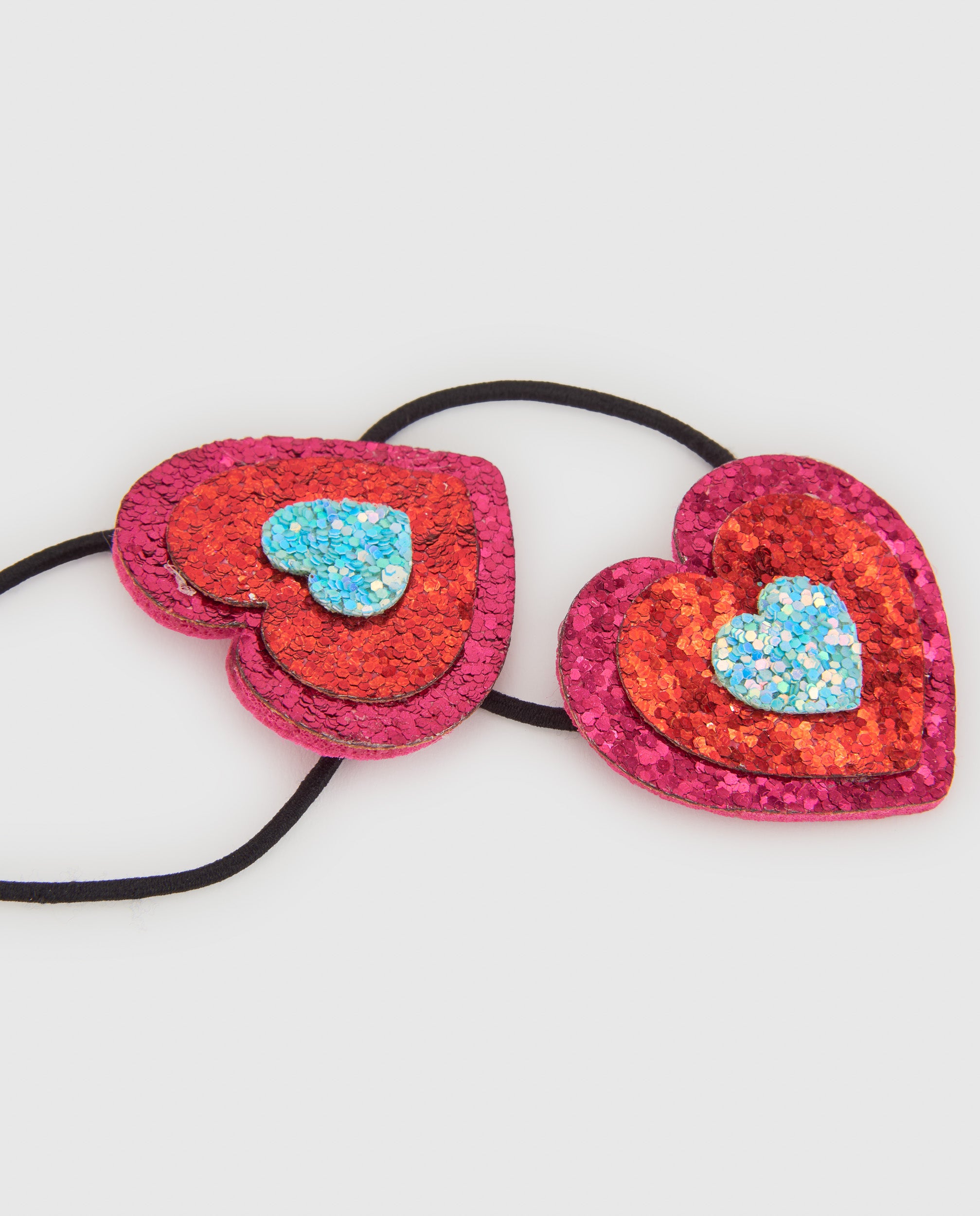 Coleteros de niña con corazones de glitter y banda elástica