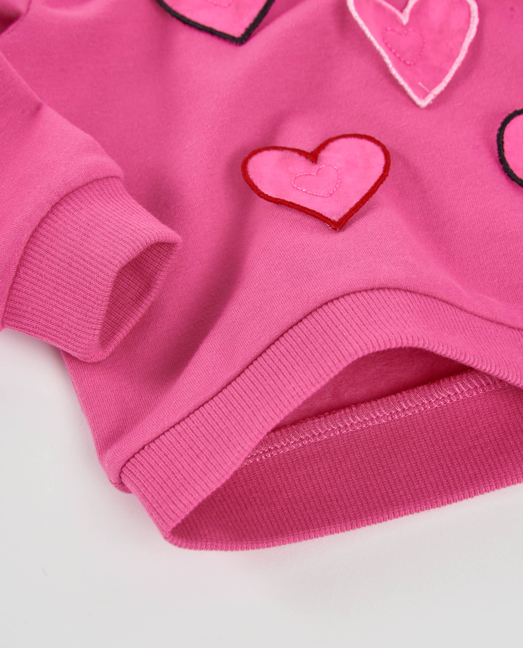 Sudadera de niña de felpa con corazones bordados y tejido cálido