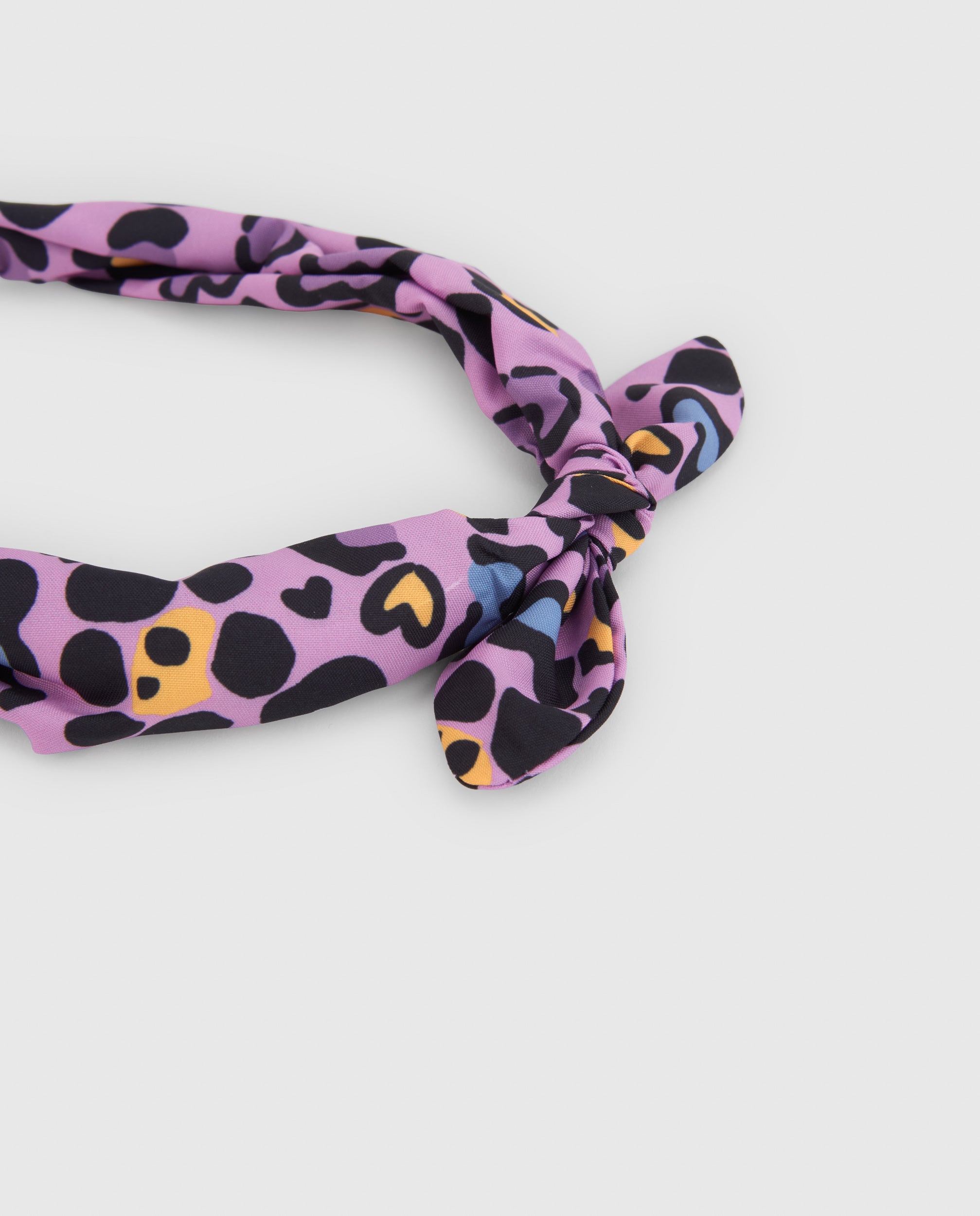 Diadema de niña rígida con estampado animal print y nudo