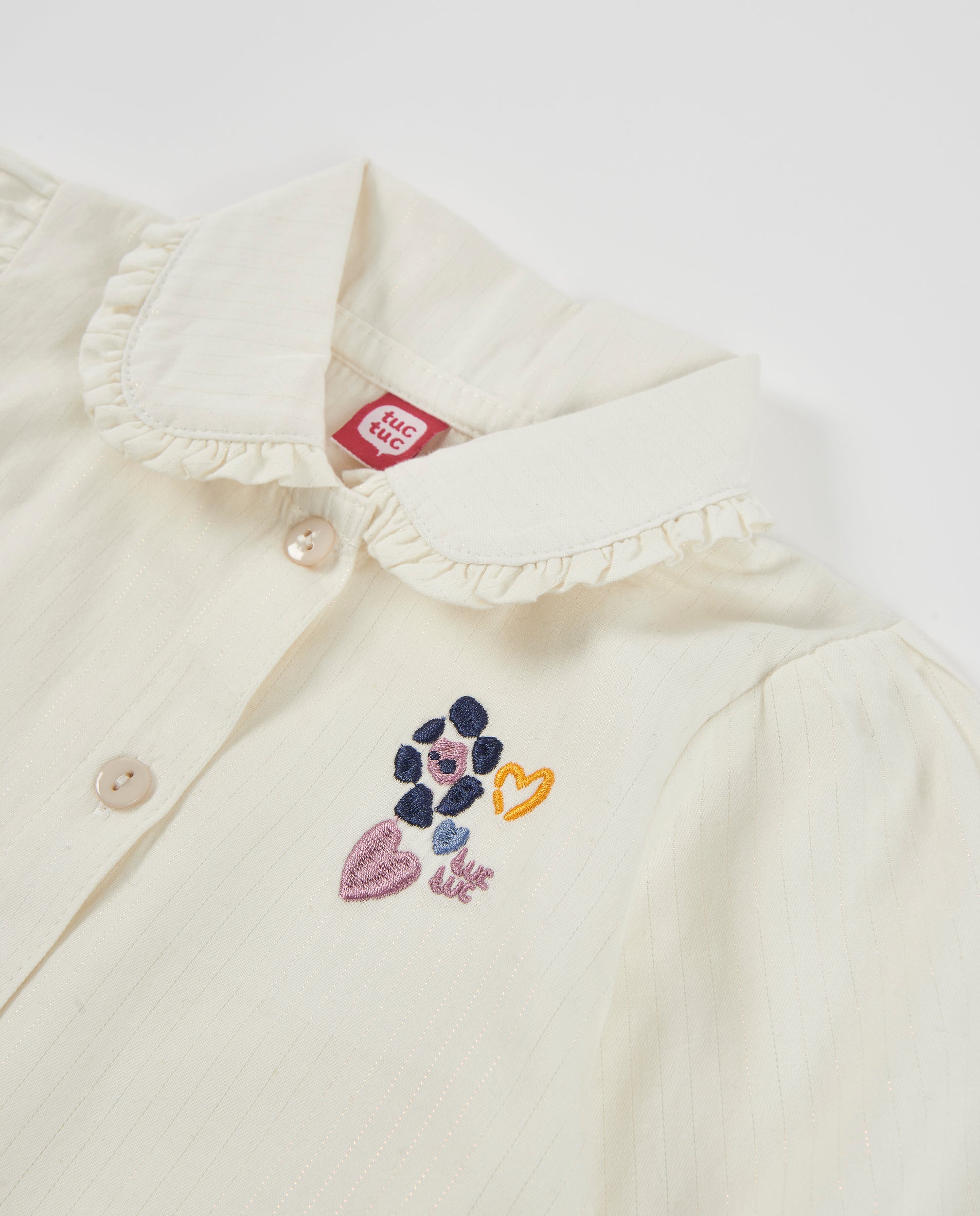 Blusa de niña de tela plana con cuello de volante y bordado