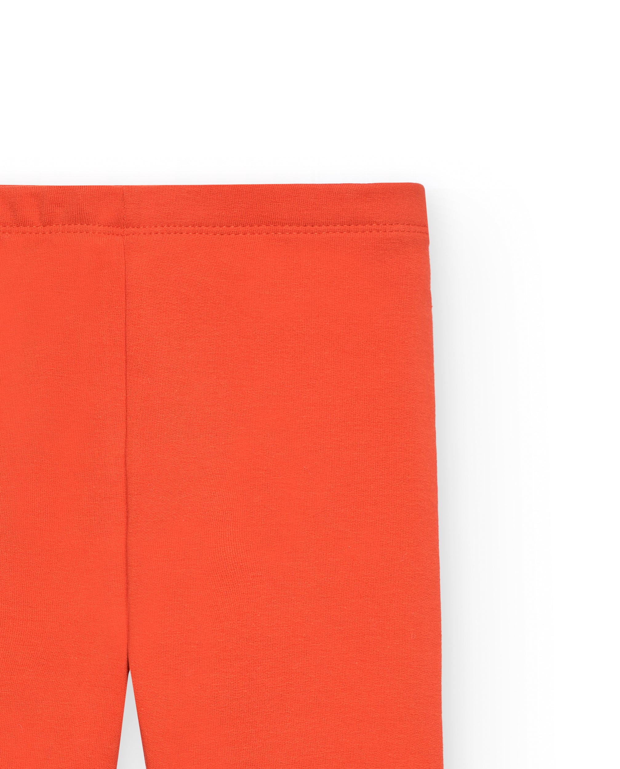 Leggings para niña en naranja con detalle floral colección