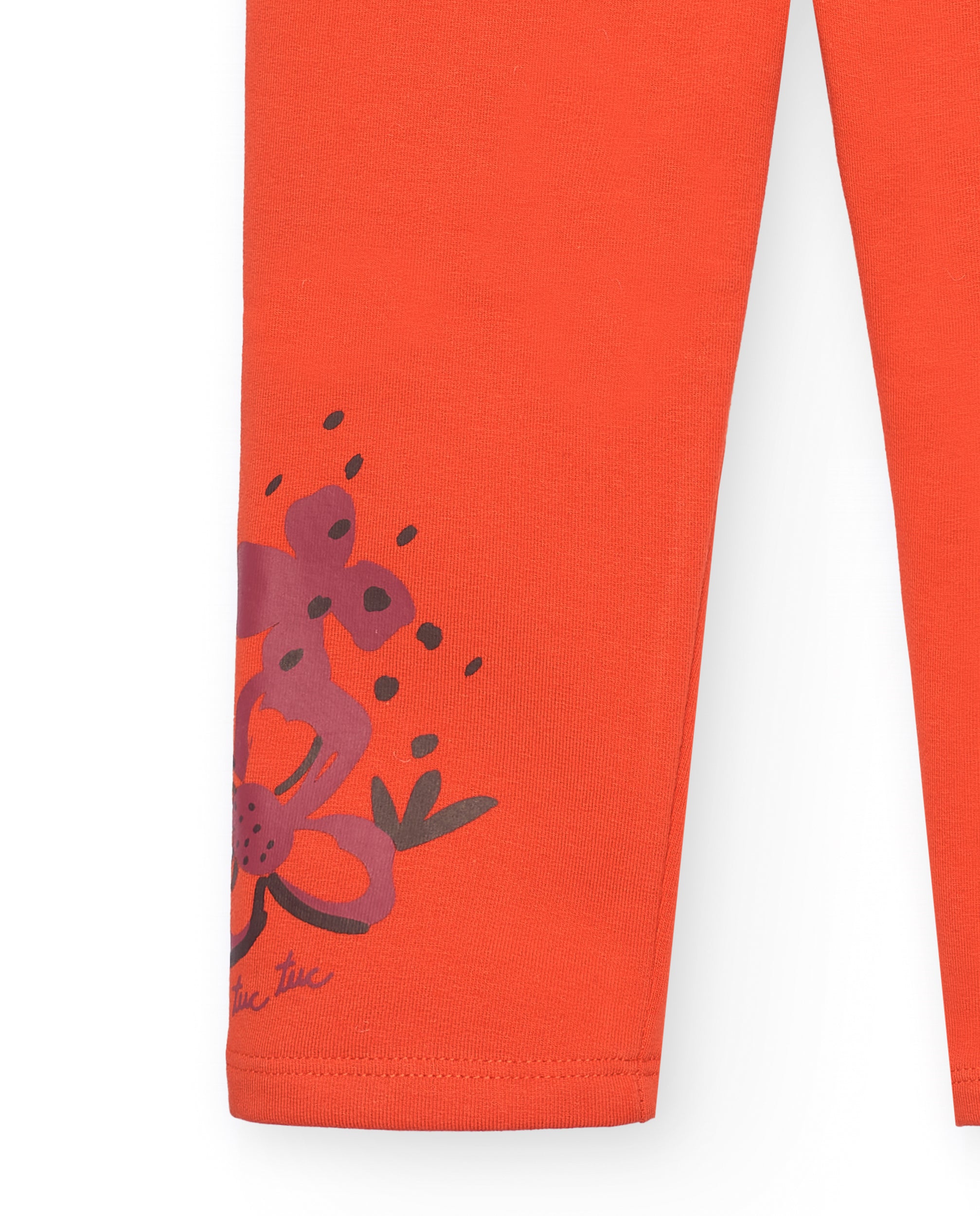 Leggings para niña en naranja con detalle floral colección