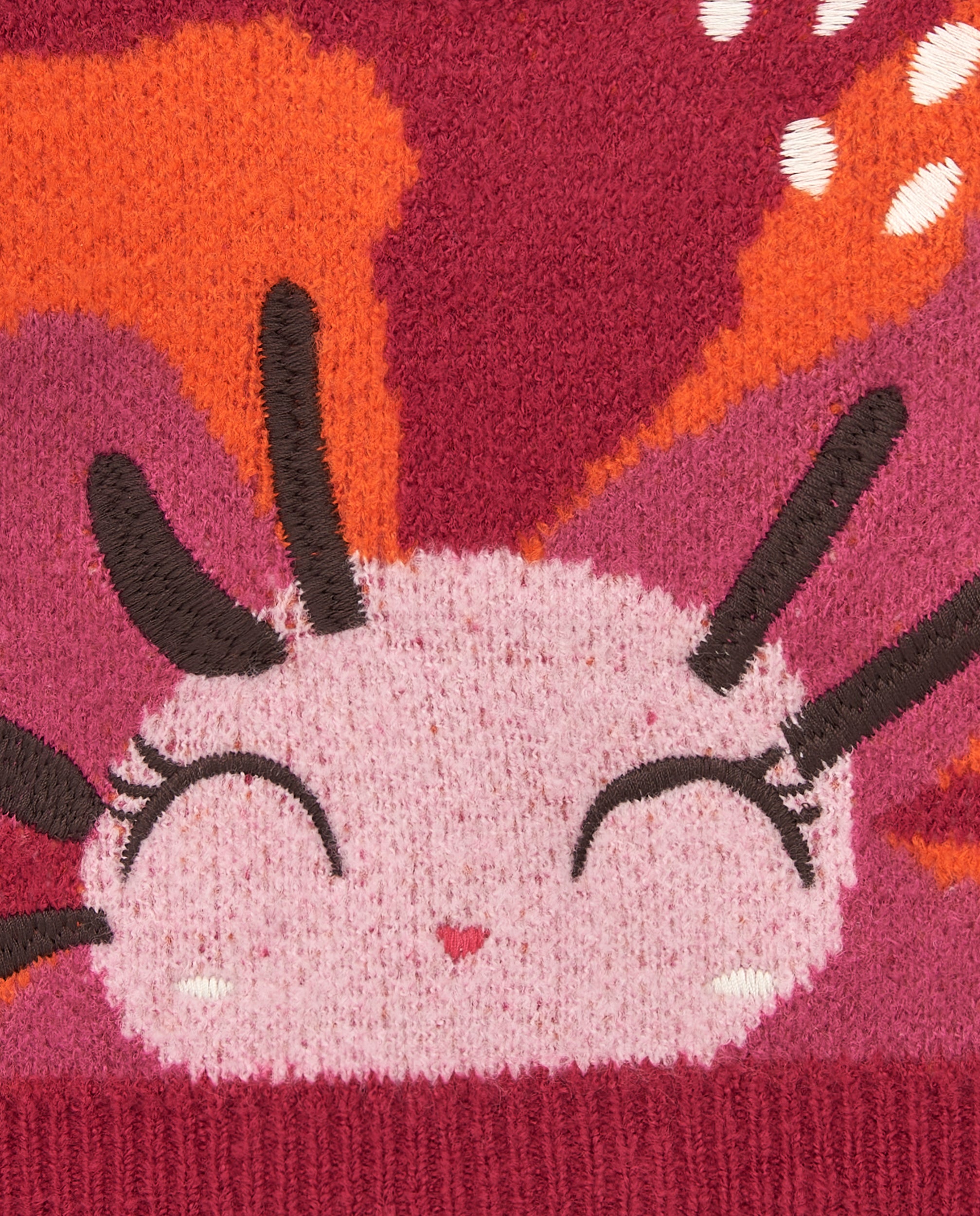 Suéter de niña en rojo con diseño de cara sonriente colección