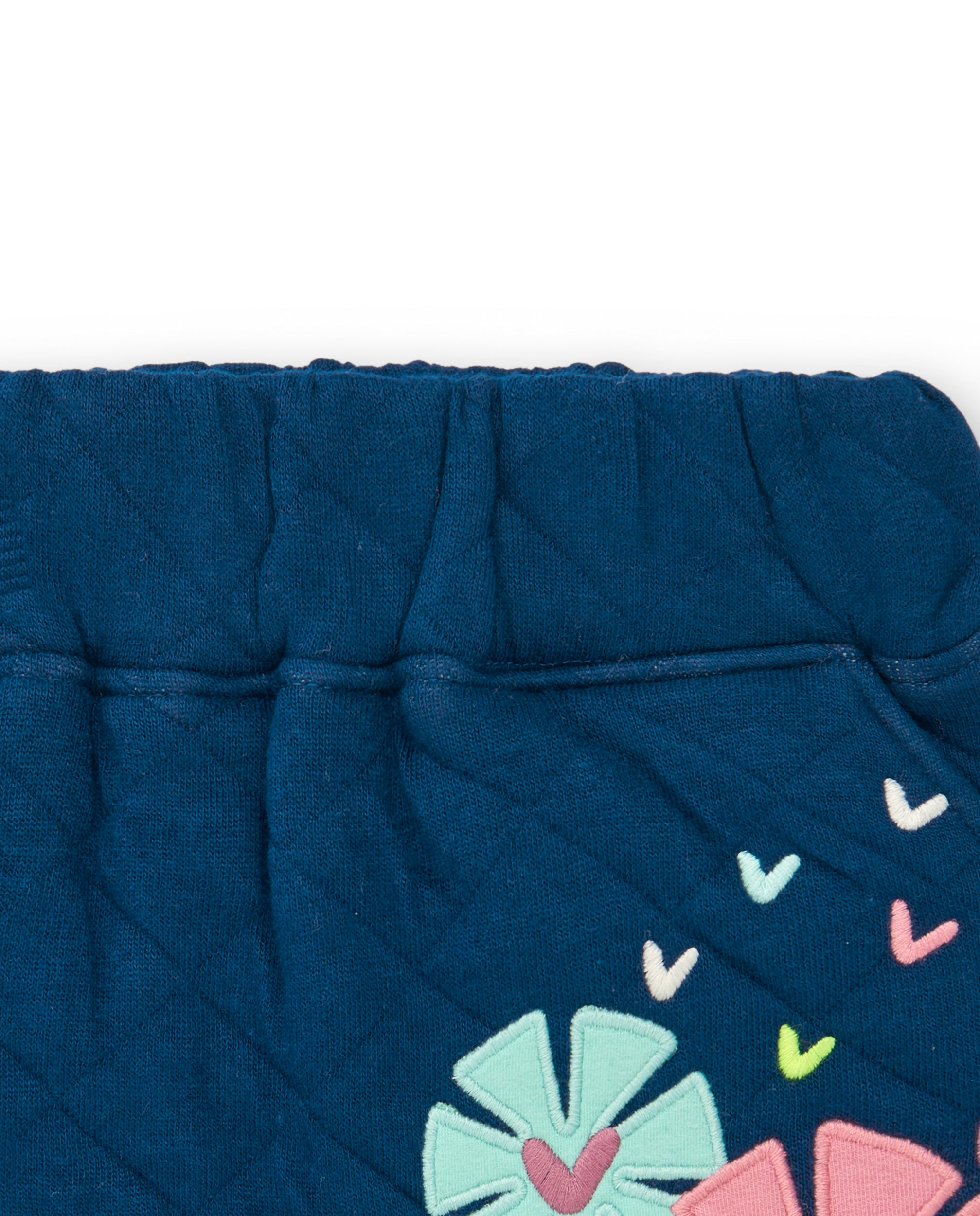 Falda acolchada azul con detalles de flores para niña de la