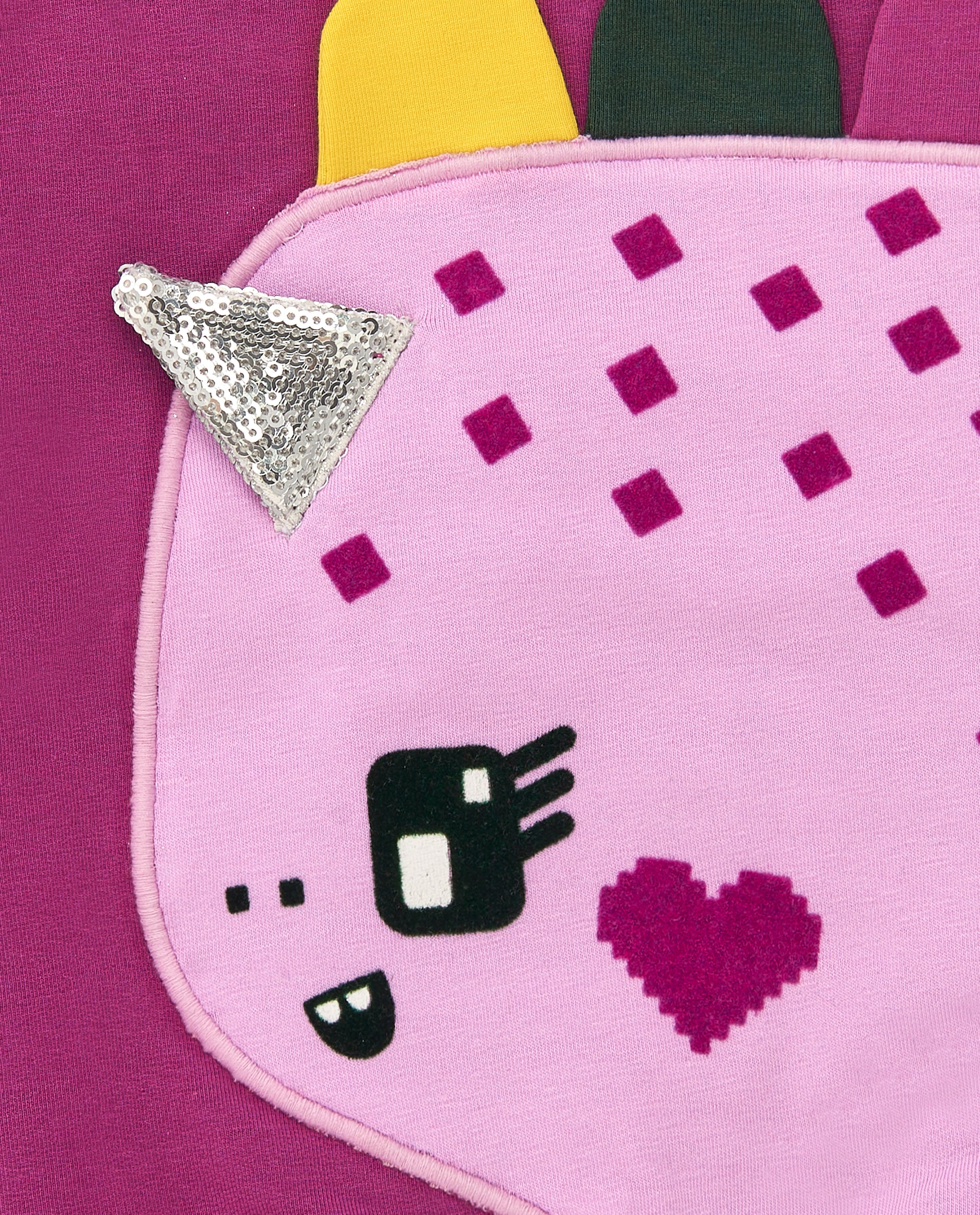 Sudadera morada con dinosaurio de apliques y detalles