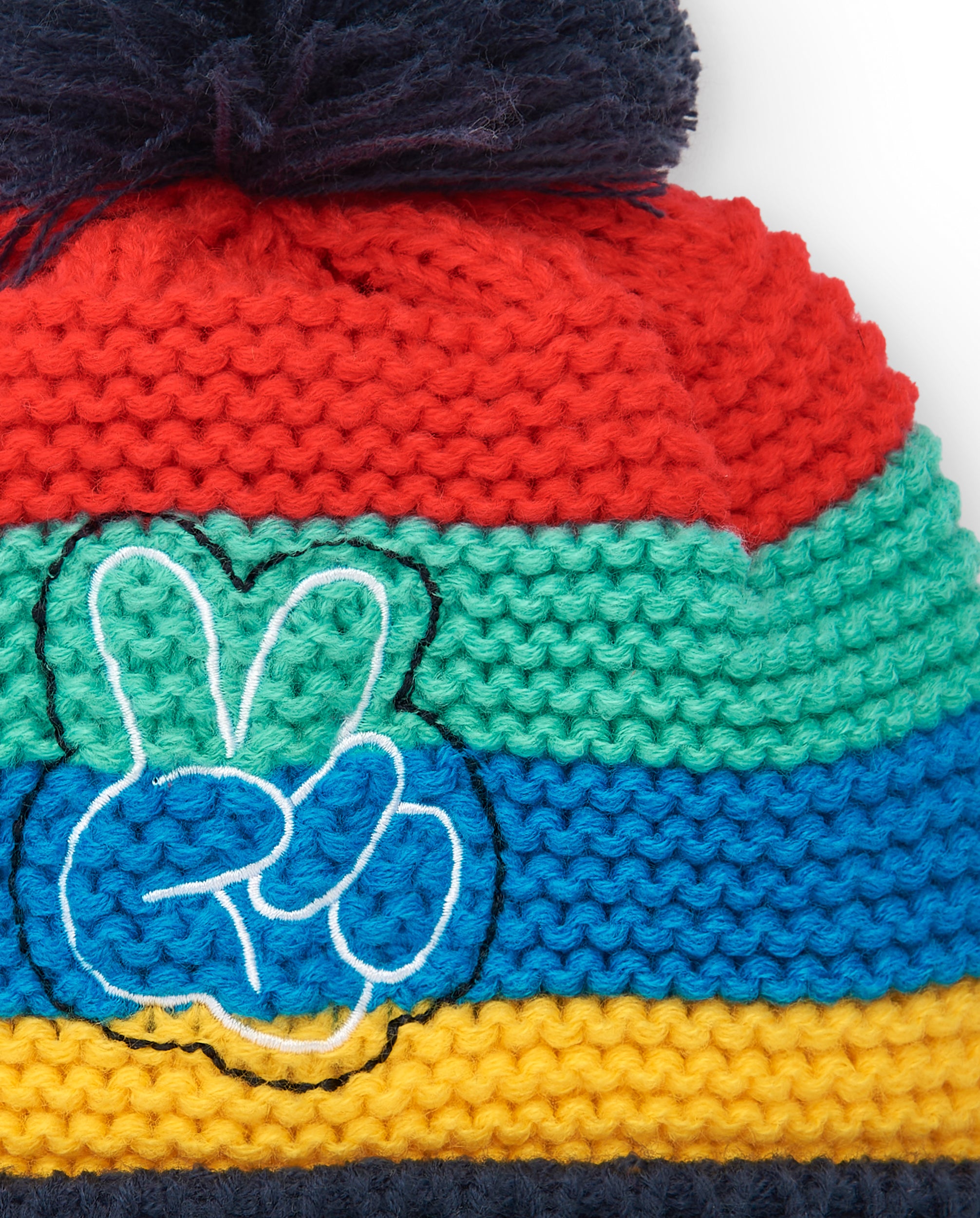 Gorro niño en colores vivos con diseño bordado y pompón