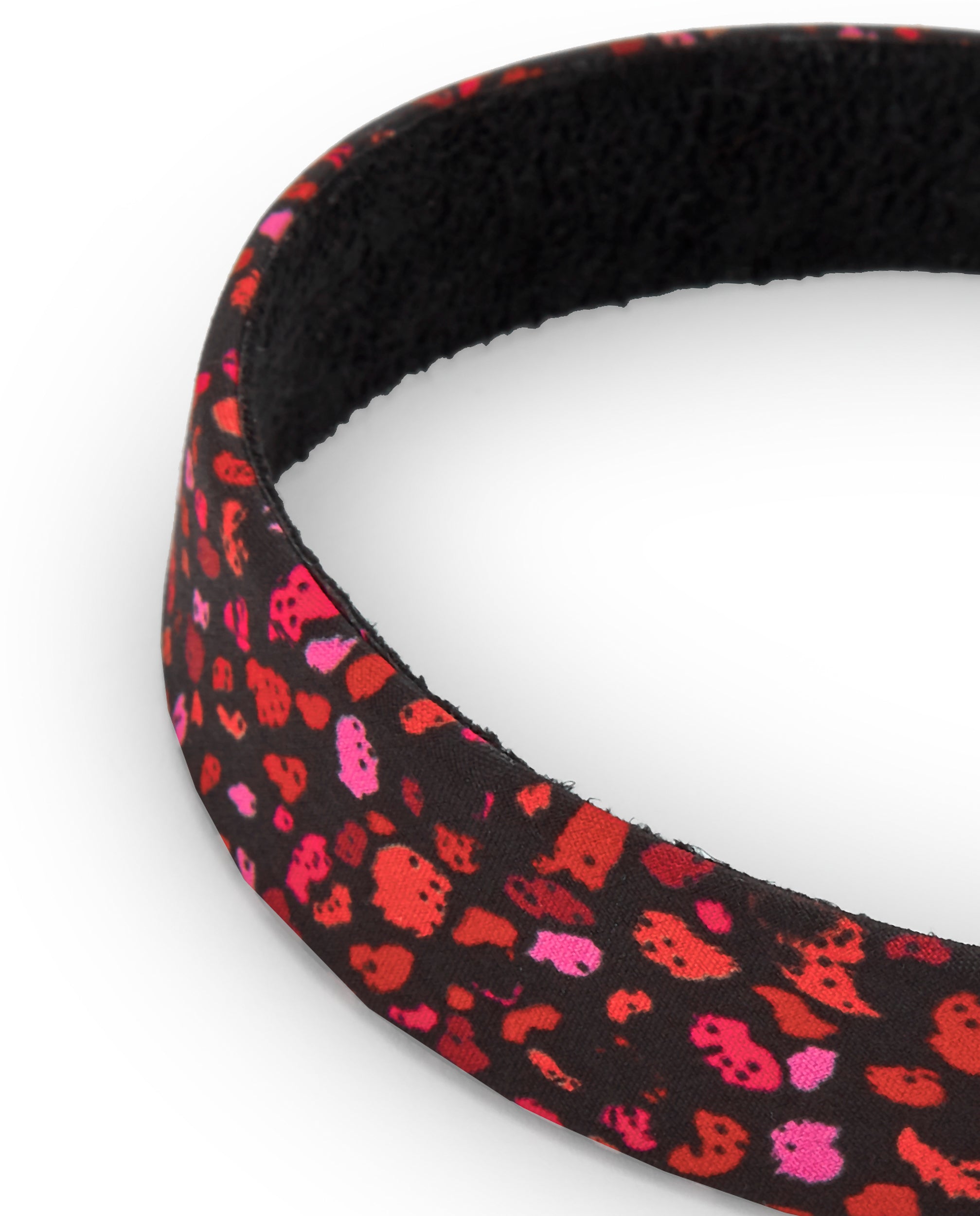 Diadema negra con estampado animal print en tonos rosas y rojos