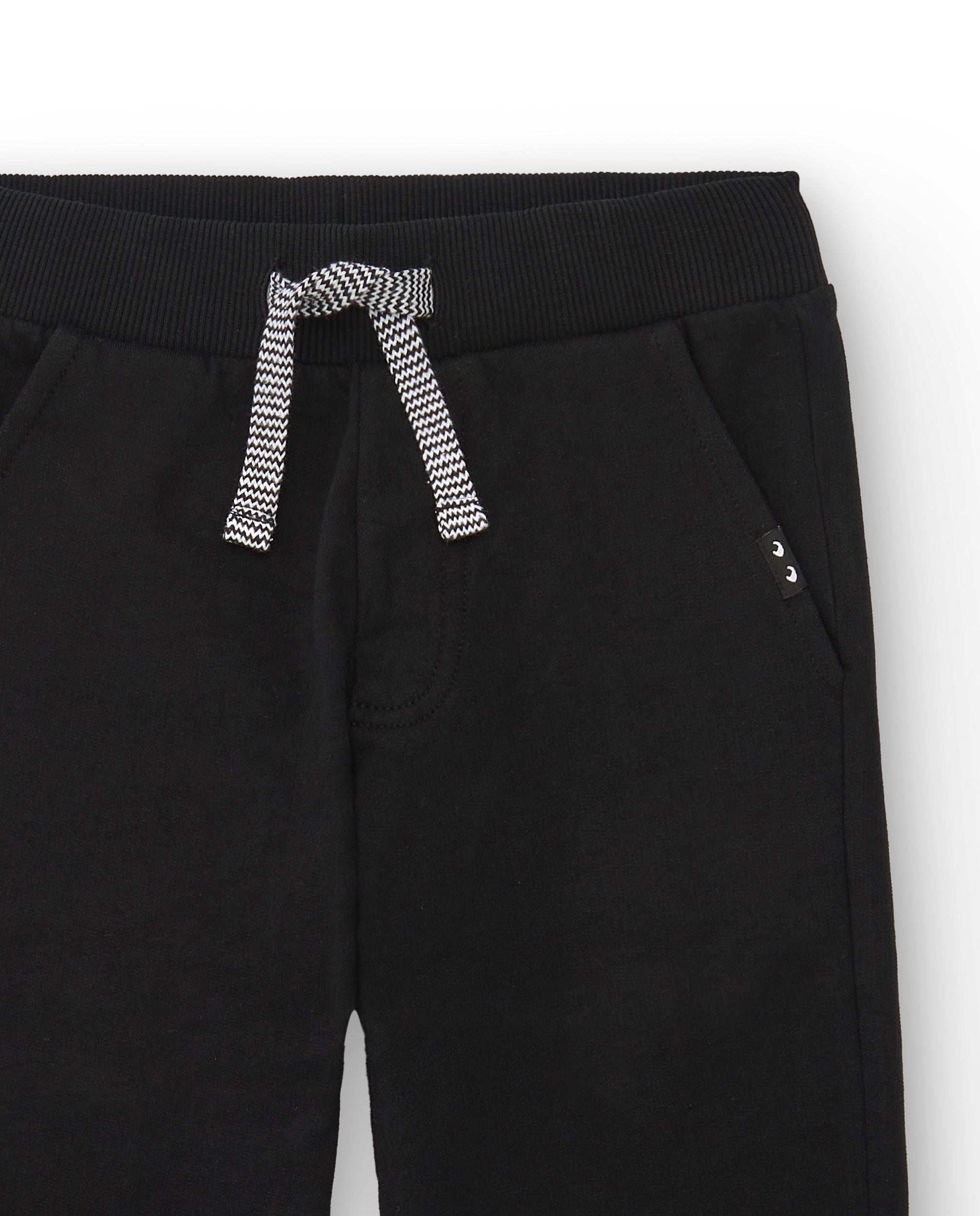 Pantalón jogger niño en negro con cordón bicolor ajustable