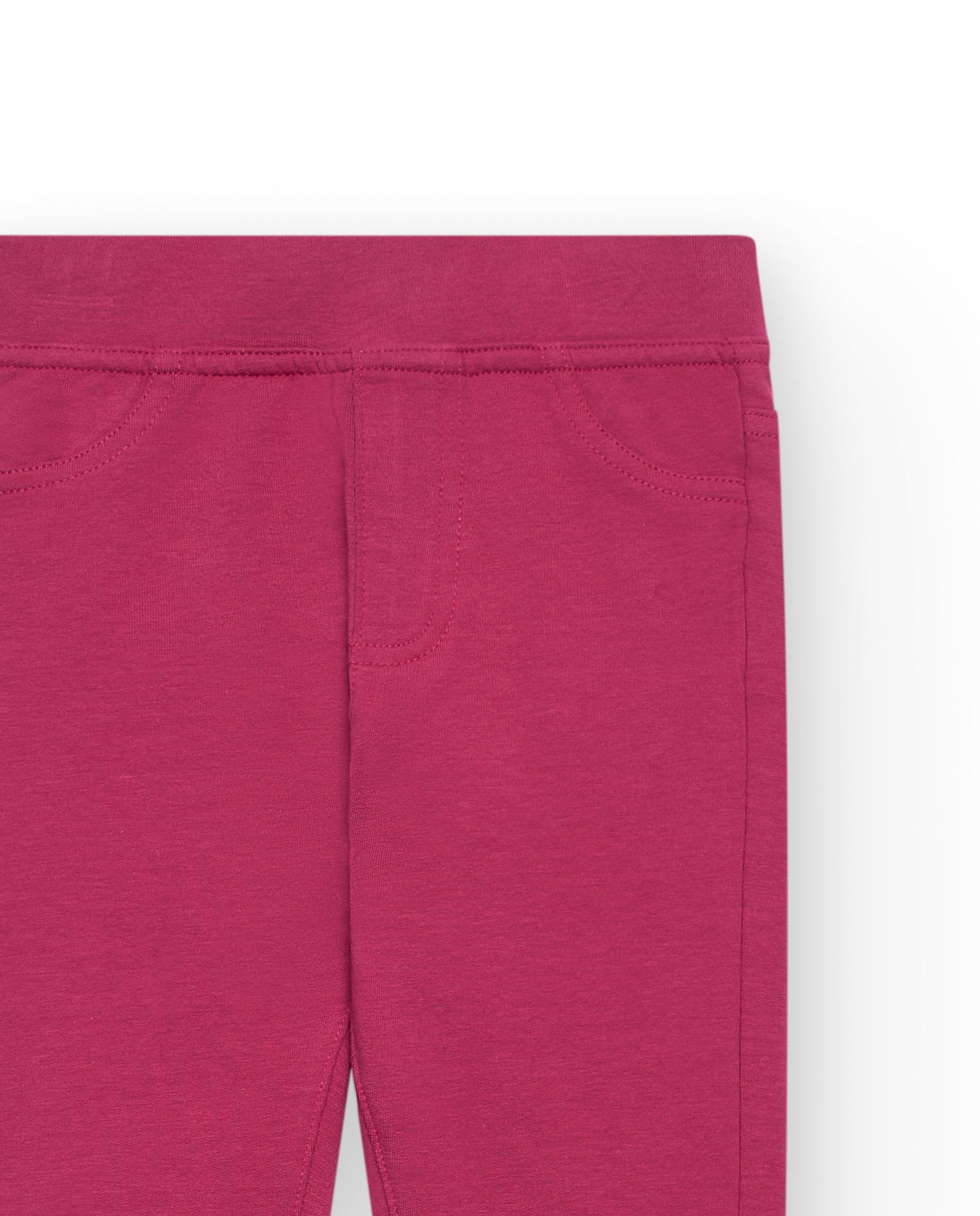 Leggings niña en color fucsia con detalles de bolsillos