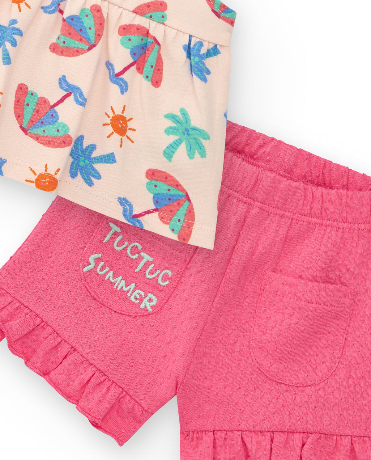 Conjunto crema para niña con blusa de paraguas y shorts rosa