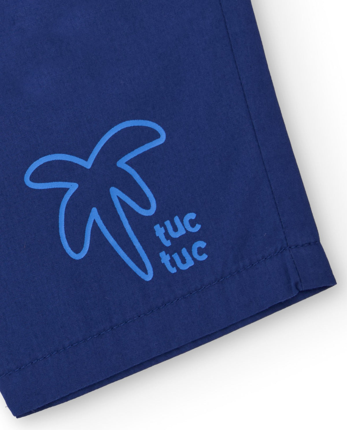 Bermuda para niño en azul con estampado de palmera