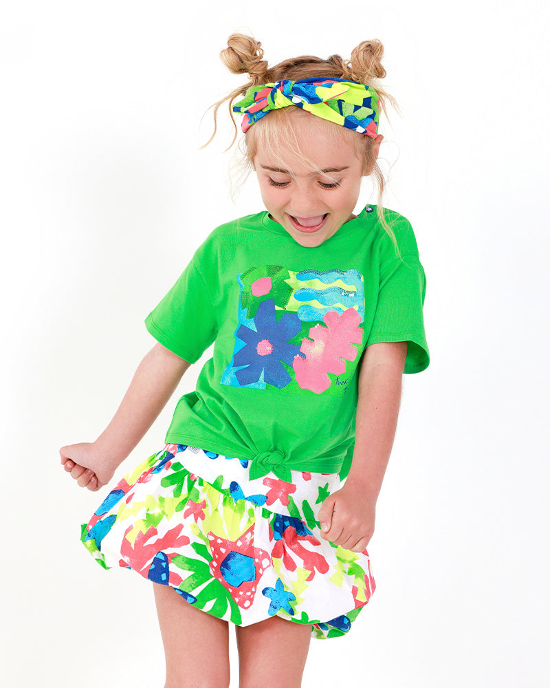 Falda para niña en blanco con estampado tropical multicolor