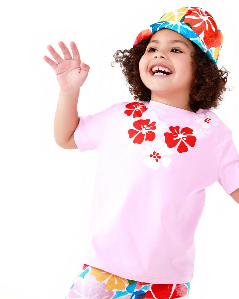 Camiseta para niña en rosa con estampado floral y cierre en el hombro