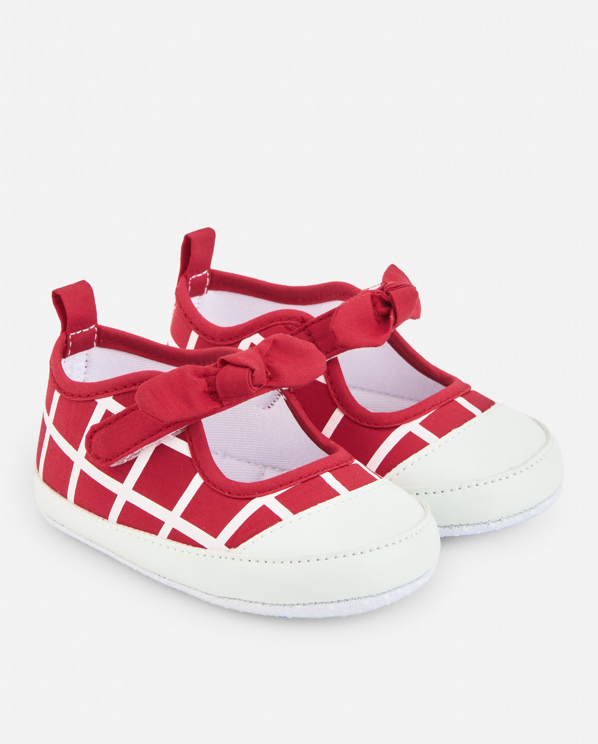 Merceditas de bebé niña en rojo con diseño de cuadros y lazo decorativo