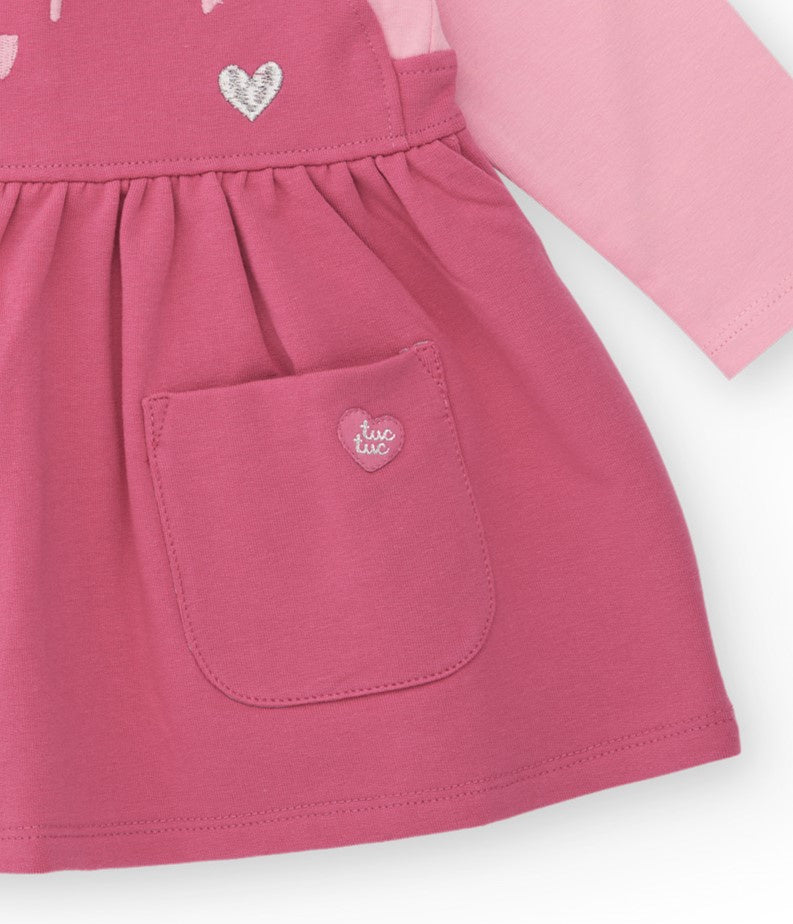 Vestido para recién nacido en tonos rosa con estampado de carita