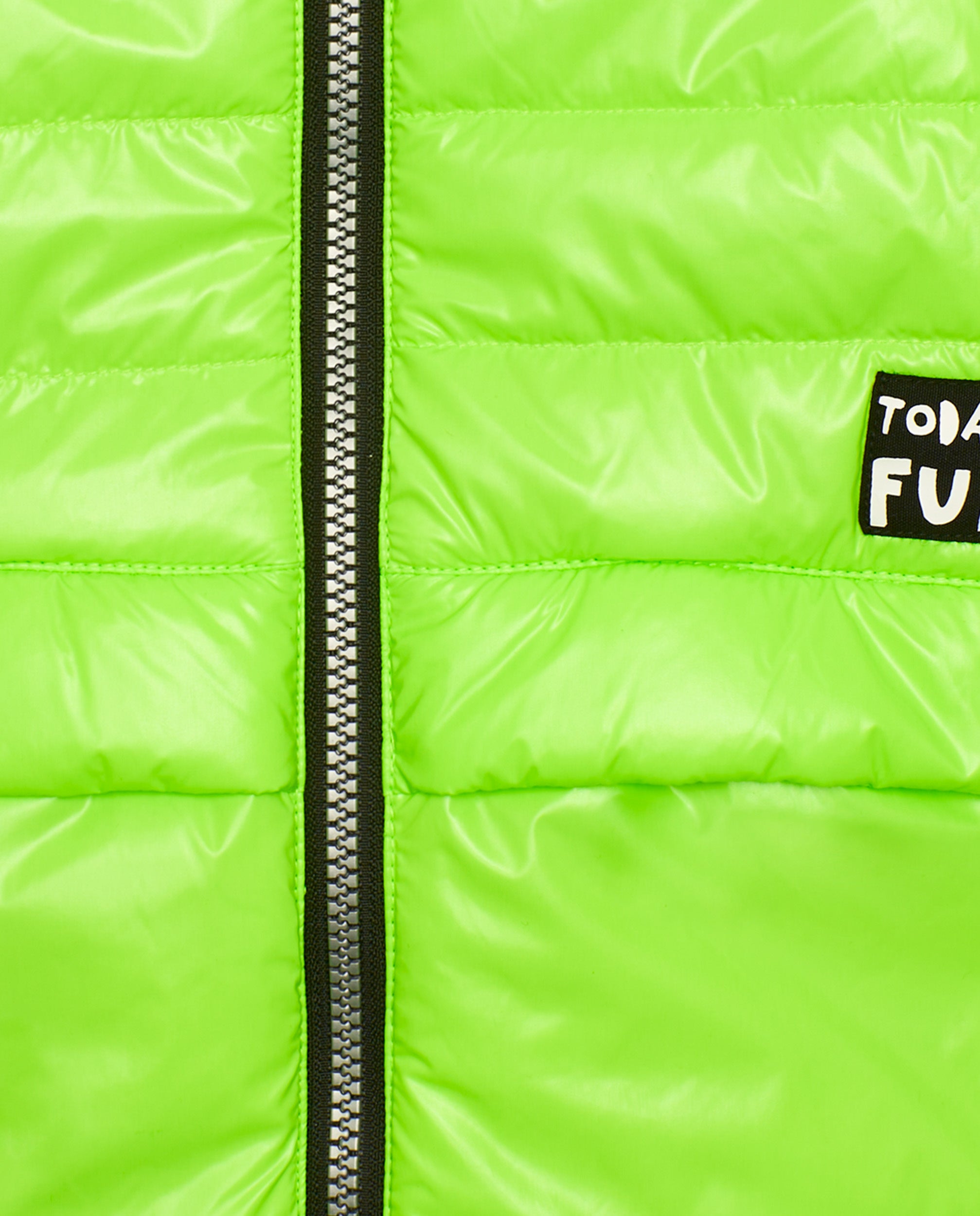Cazadora para niño en verde flúor con mensaje gráfico