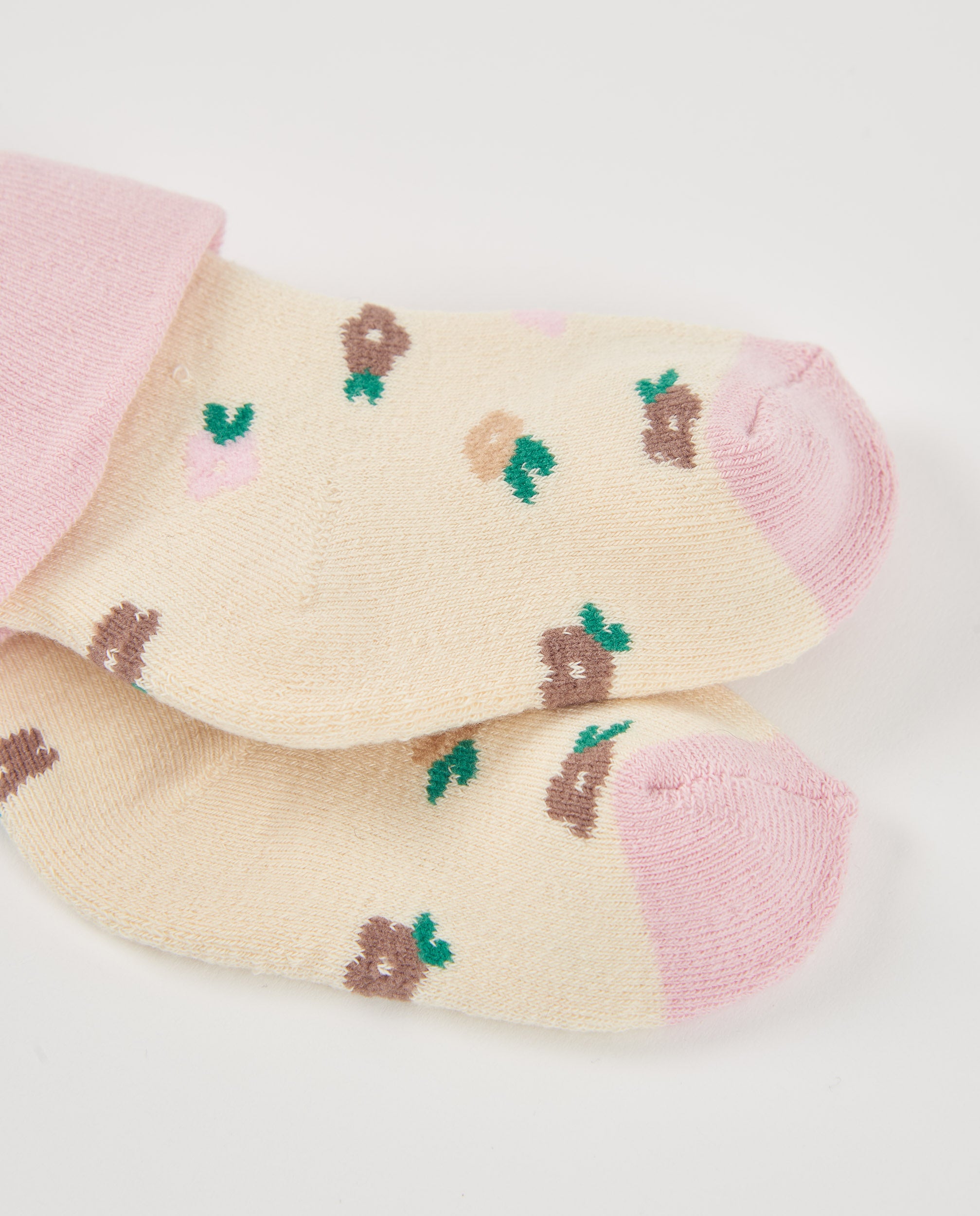 Calcetines para recién nacido en tonos crema y rosa con
