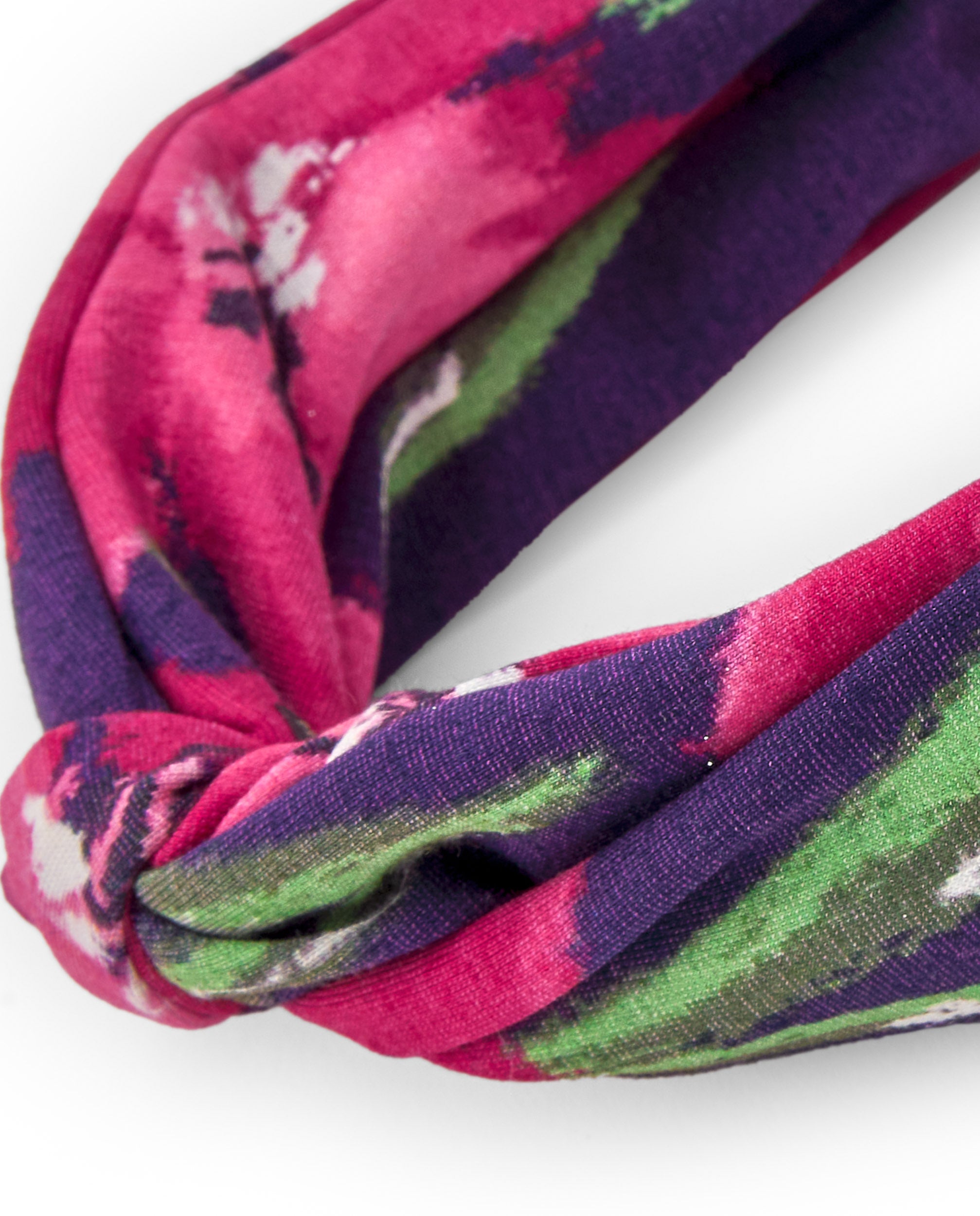 Diadema de niña con estampado floral en tonos rojos
