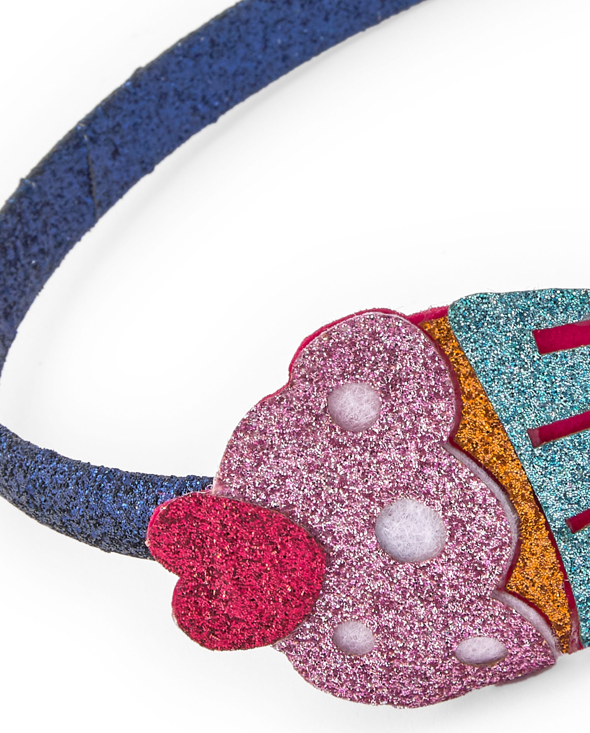 Diadema de niña en azul con aplique de cupcake brillante