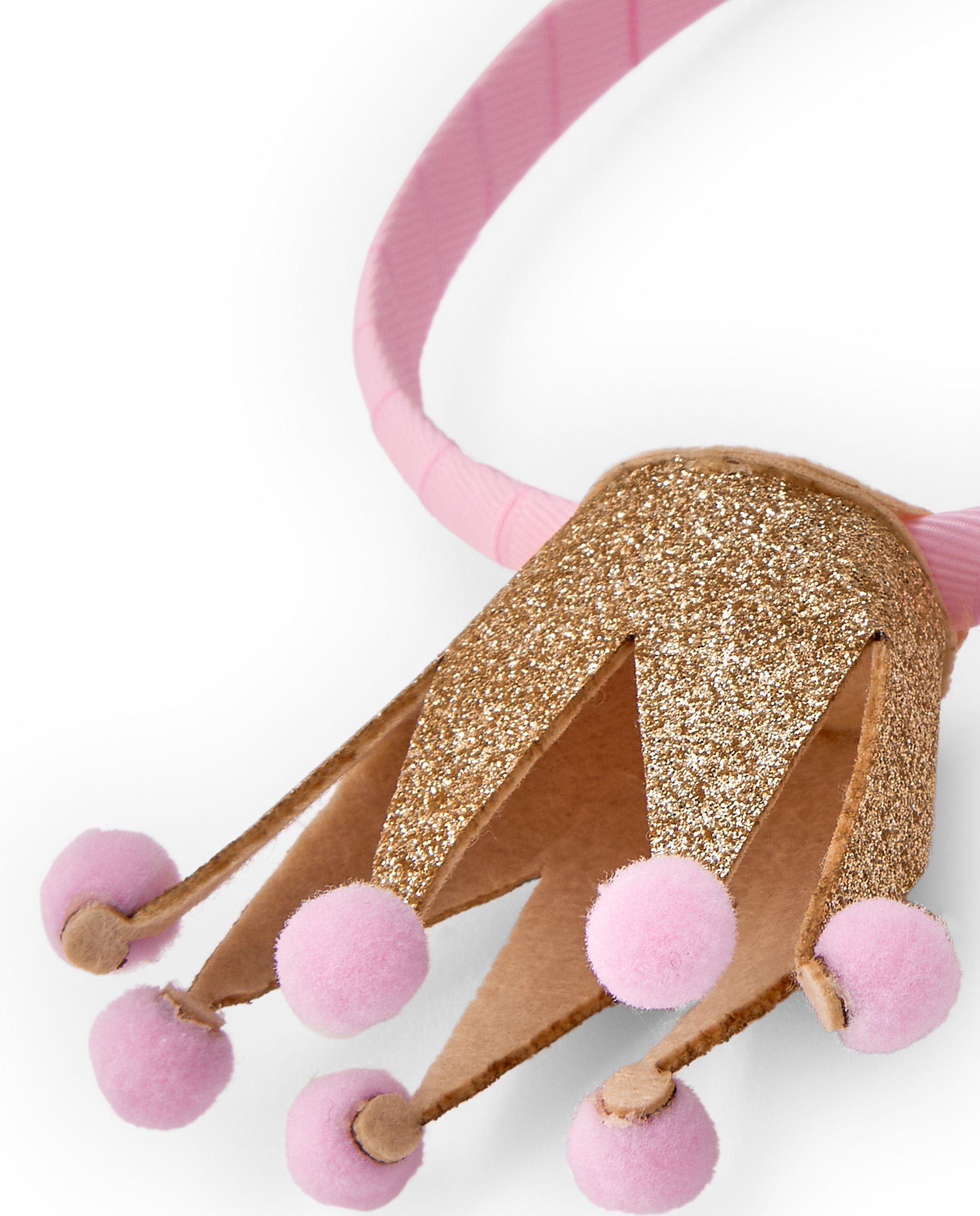 Diadema para niña color rosa con corona dorada y pompones