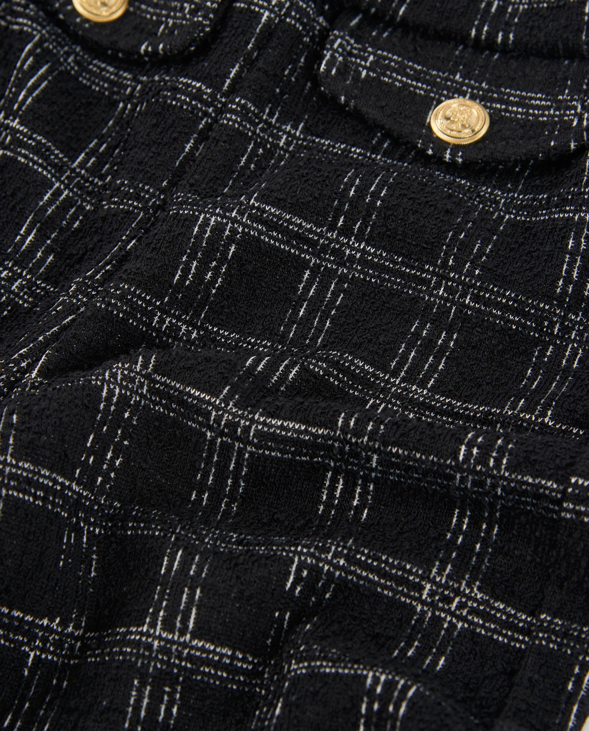 Pantalón de niña en tweed negro con cuadros grises