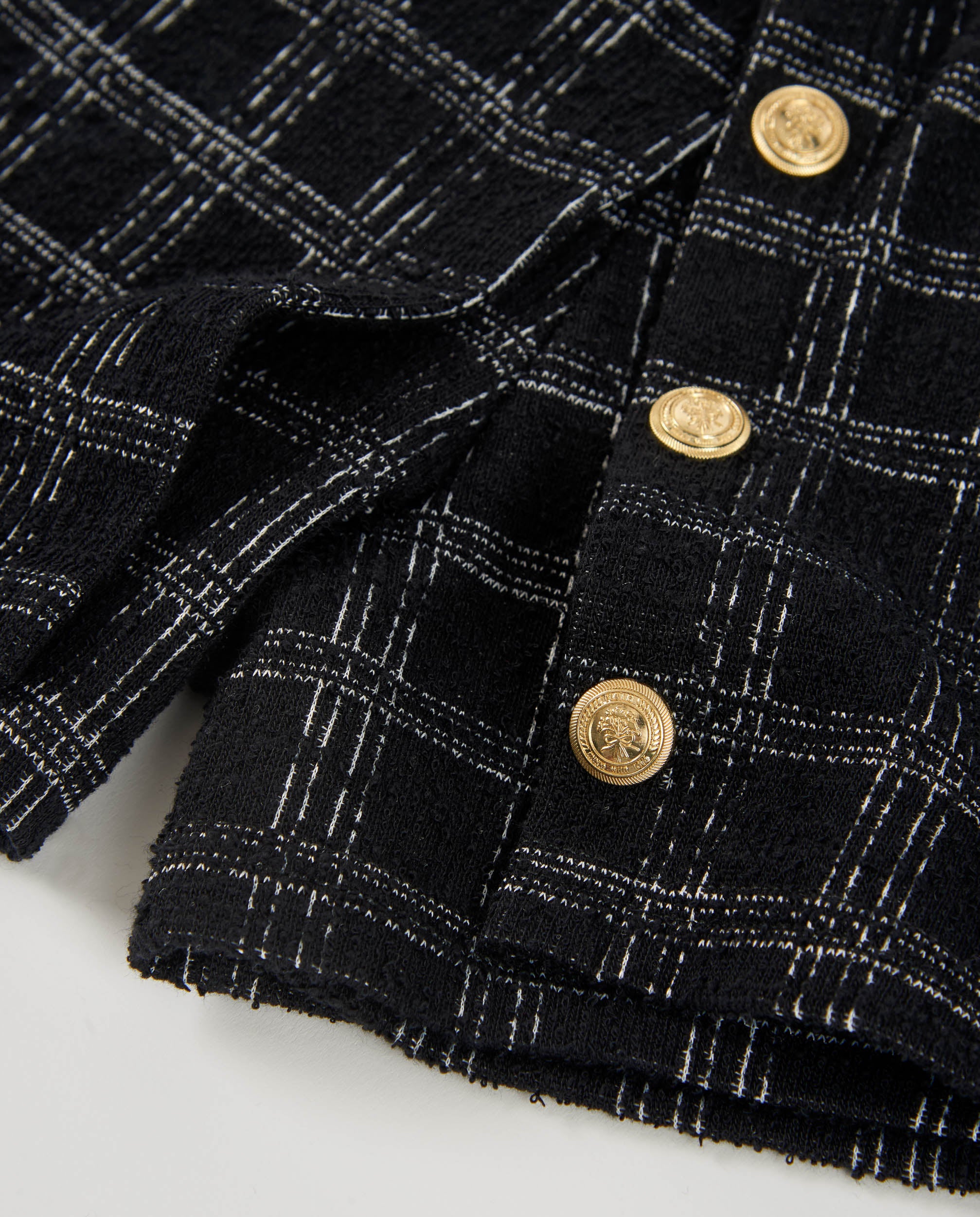 Short de niña en tweed negro con cuadros y botones dorados