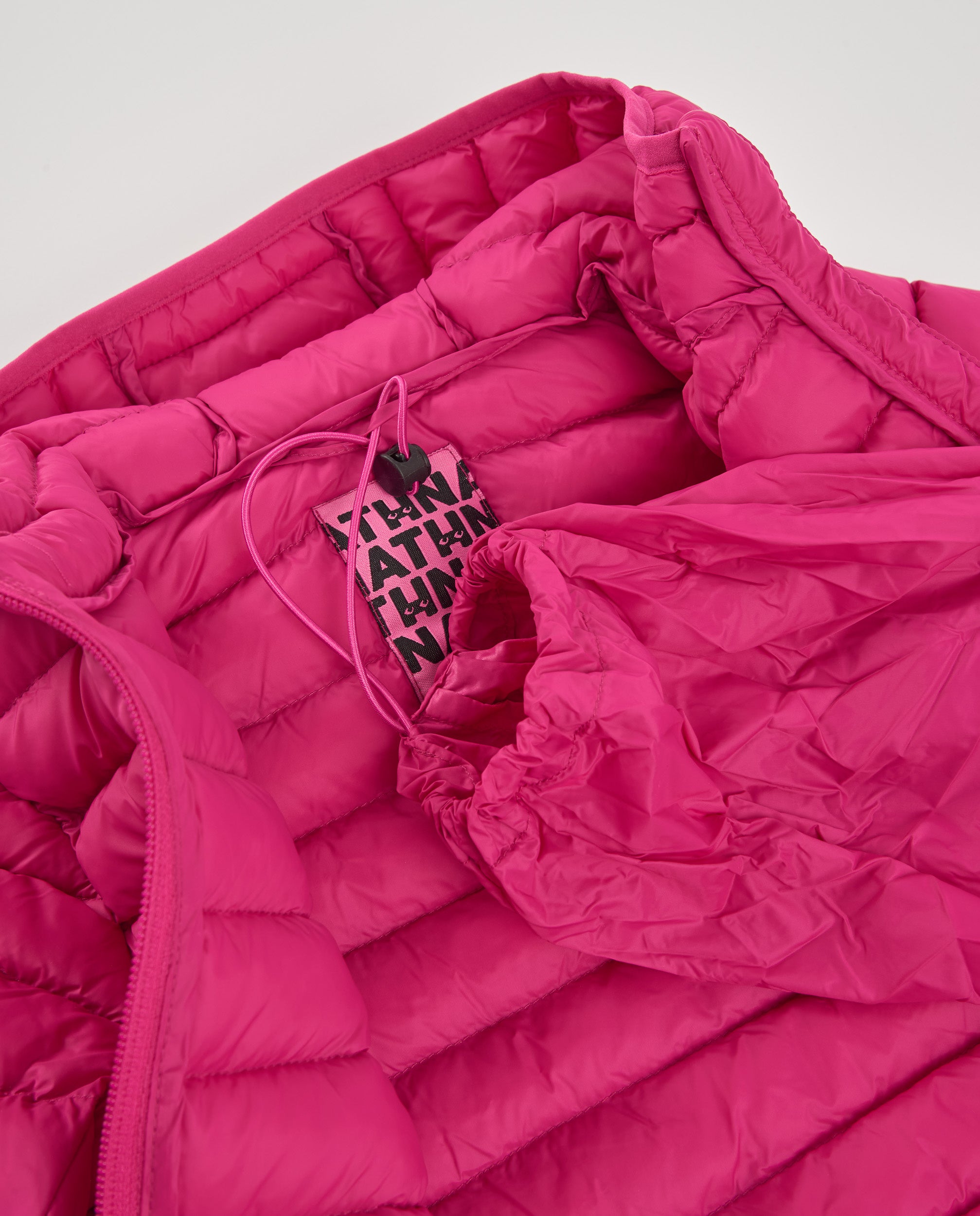 Chaqueta acolchada de niña color fucsia con capucha
