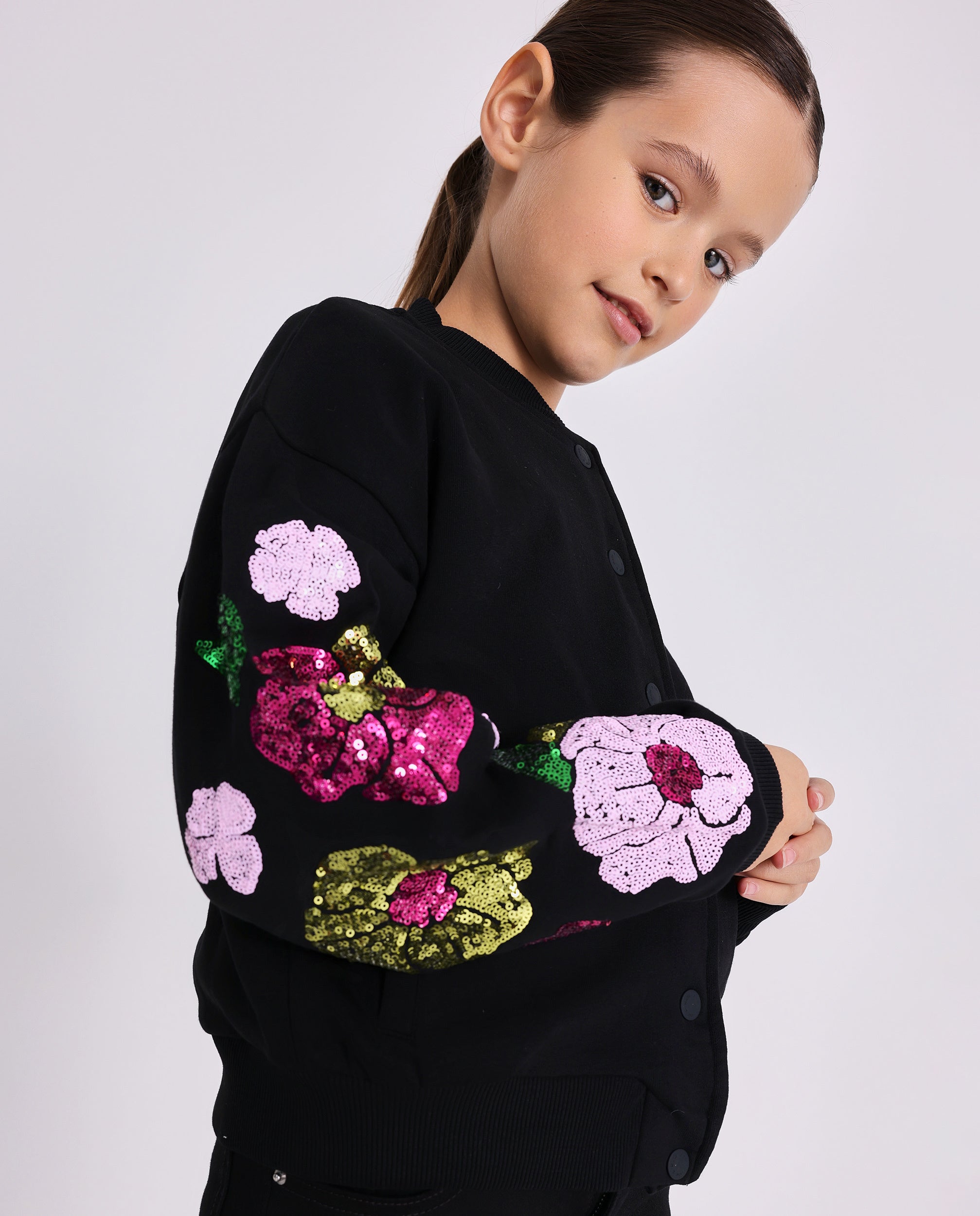Black jacket for girls with sequin flowers on the sleeves